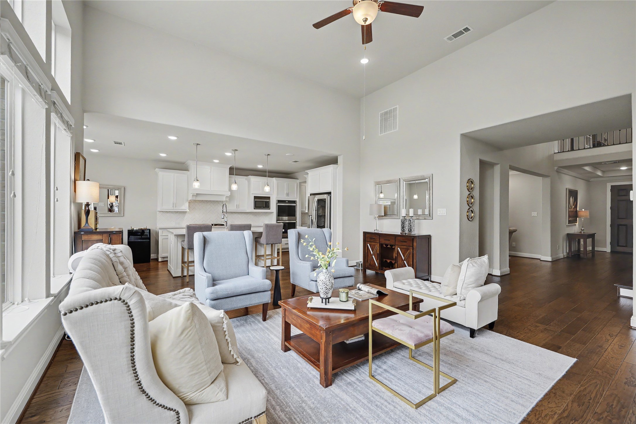 Additional view of the great room highlighting its open layout and connection to the surrounding living spaces.