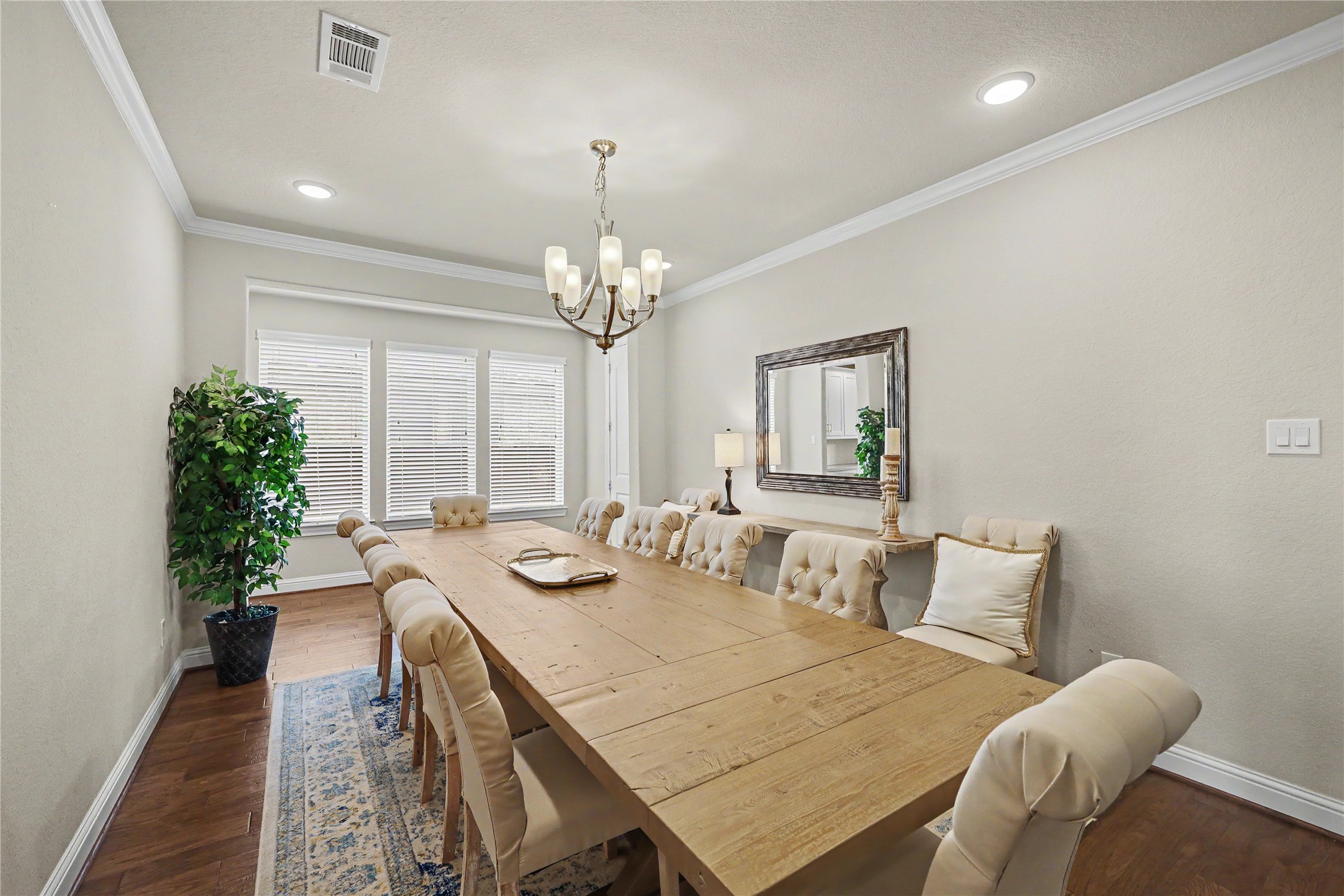 Additional view of the formal dining room with large windows and natural light.