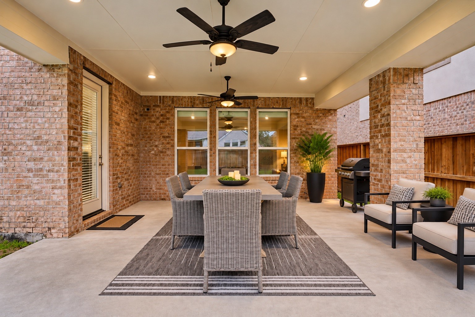 Elegant covered patio, room for outdoor entertaining.  Digitally staged.