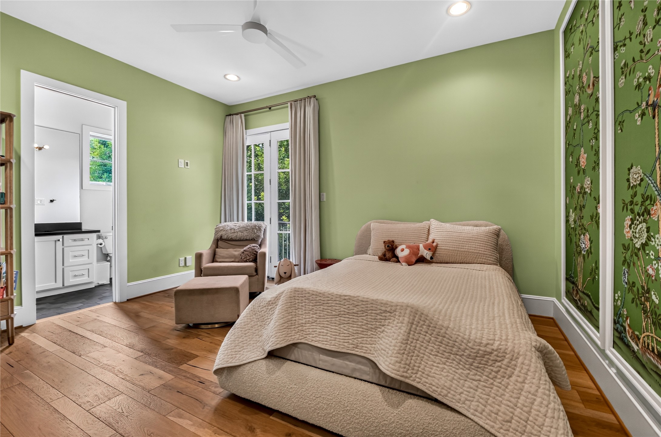 Secondary bedroom has elegant paint & wall paper. Secondary bedroom also has a private balcony.