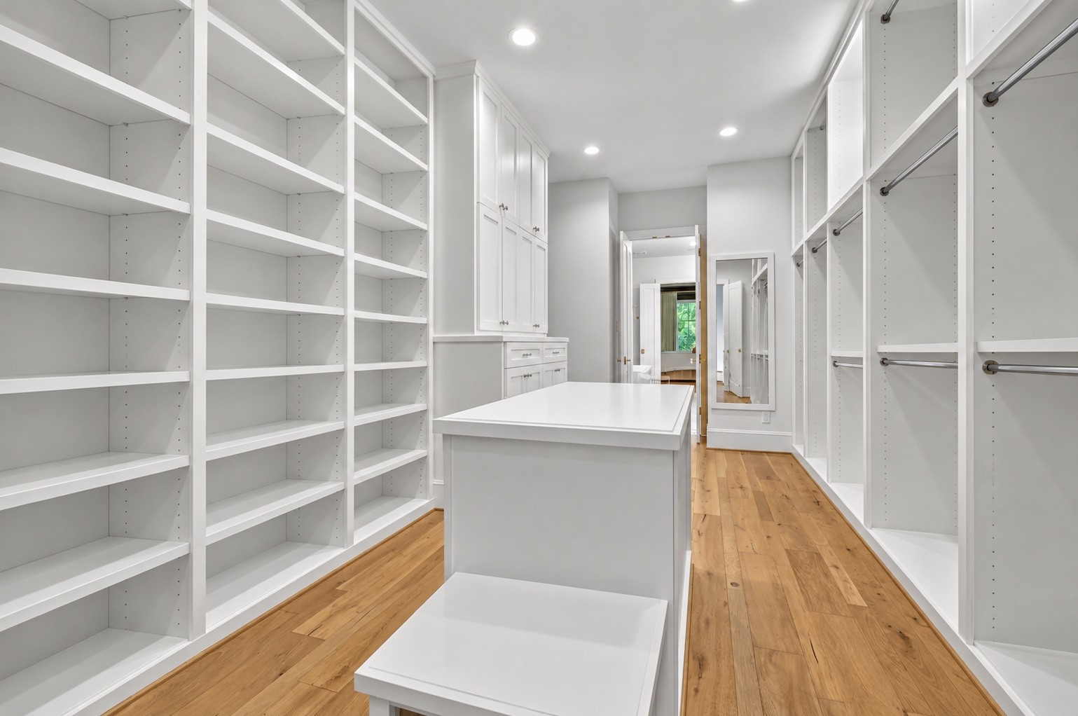 Massive primary closet keeps enough space for all amounts of clothing.