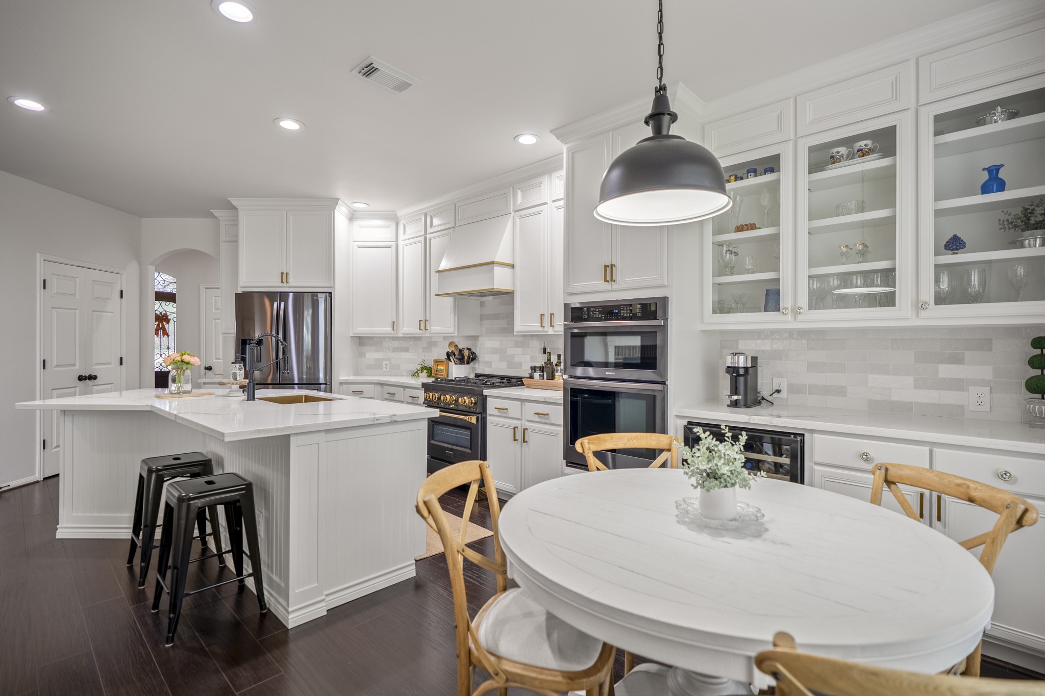 The thoughtful design features like glass-front display upper cabinets and ample storage, updated stove, lighting & appliances, this move-in-ready kitchen checks every single box on a buyer's wish list.