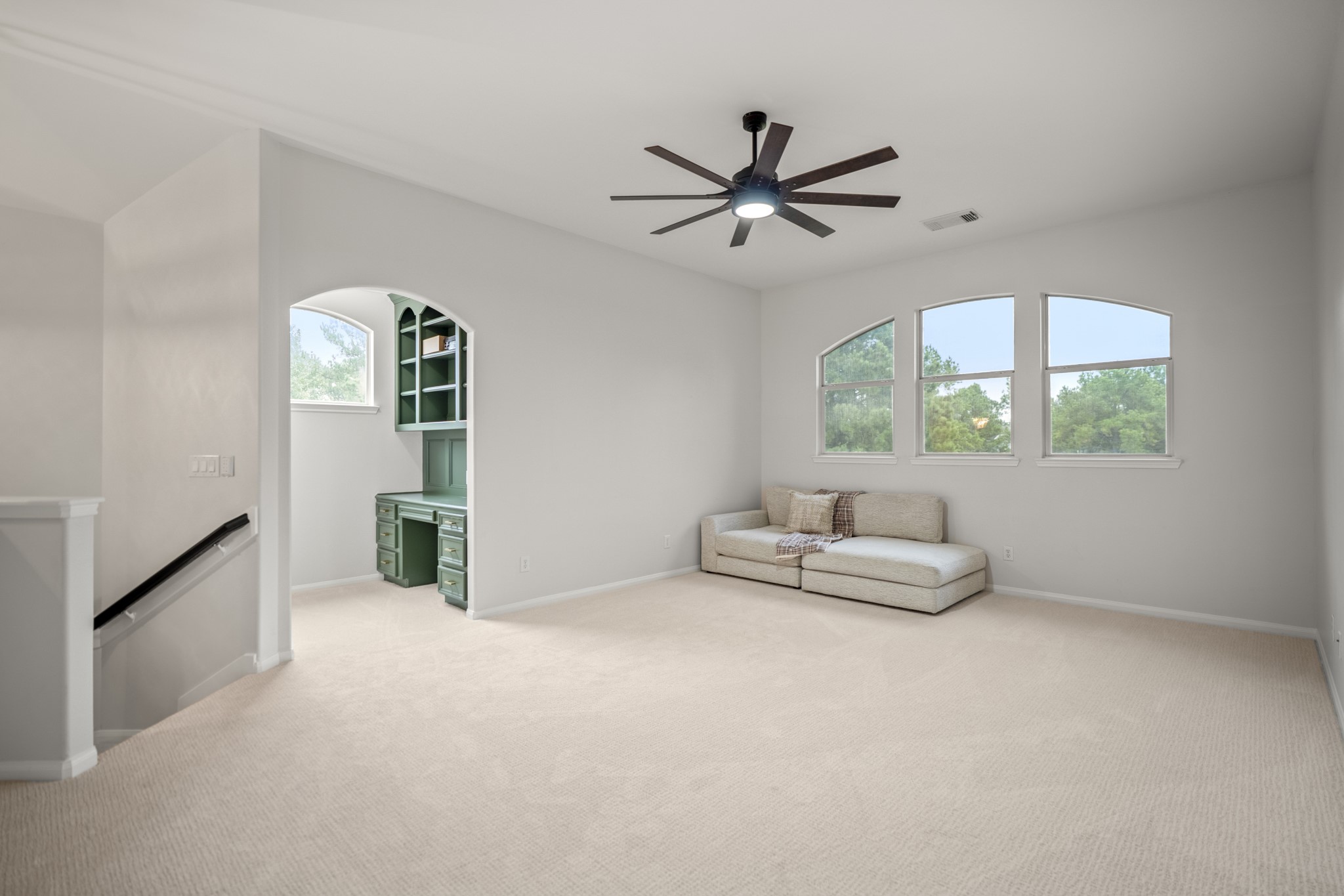 Just off the large upstairs gameroom you have an arched entry into a secondary office nook, ideal for members of your family that need an additional work space.