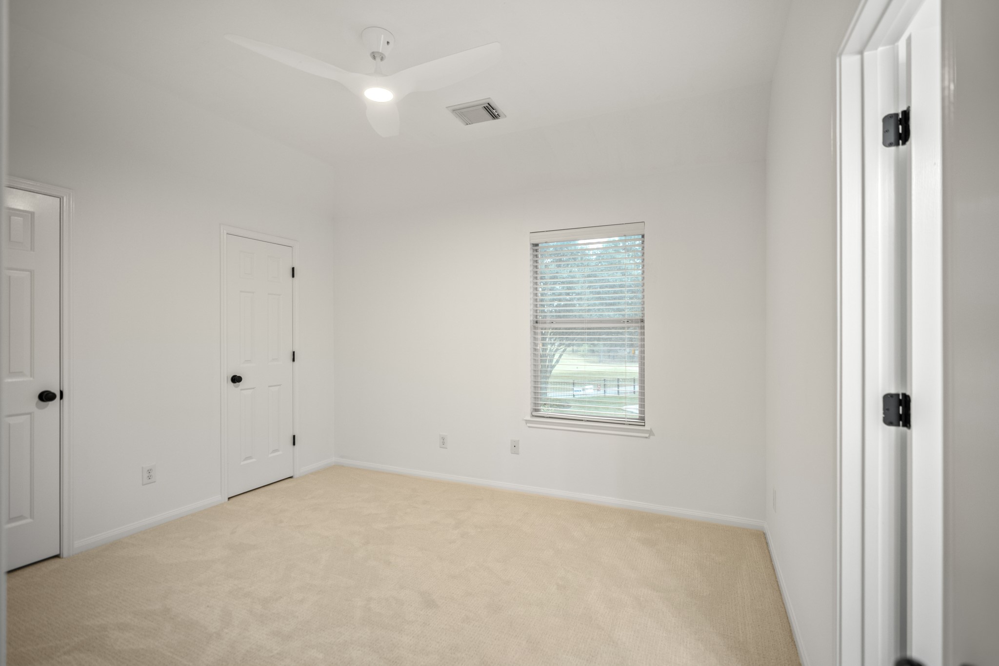This is the fourth bedroom, which is upstairs, has a window and ceiling light and nice sized closet.