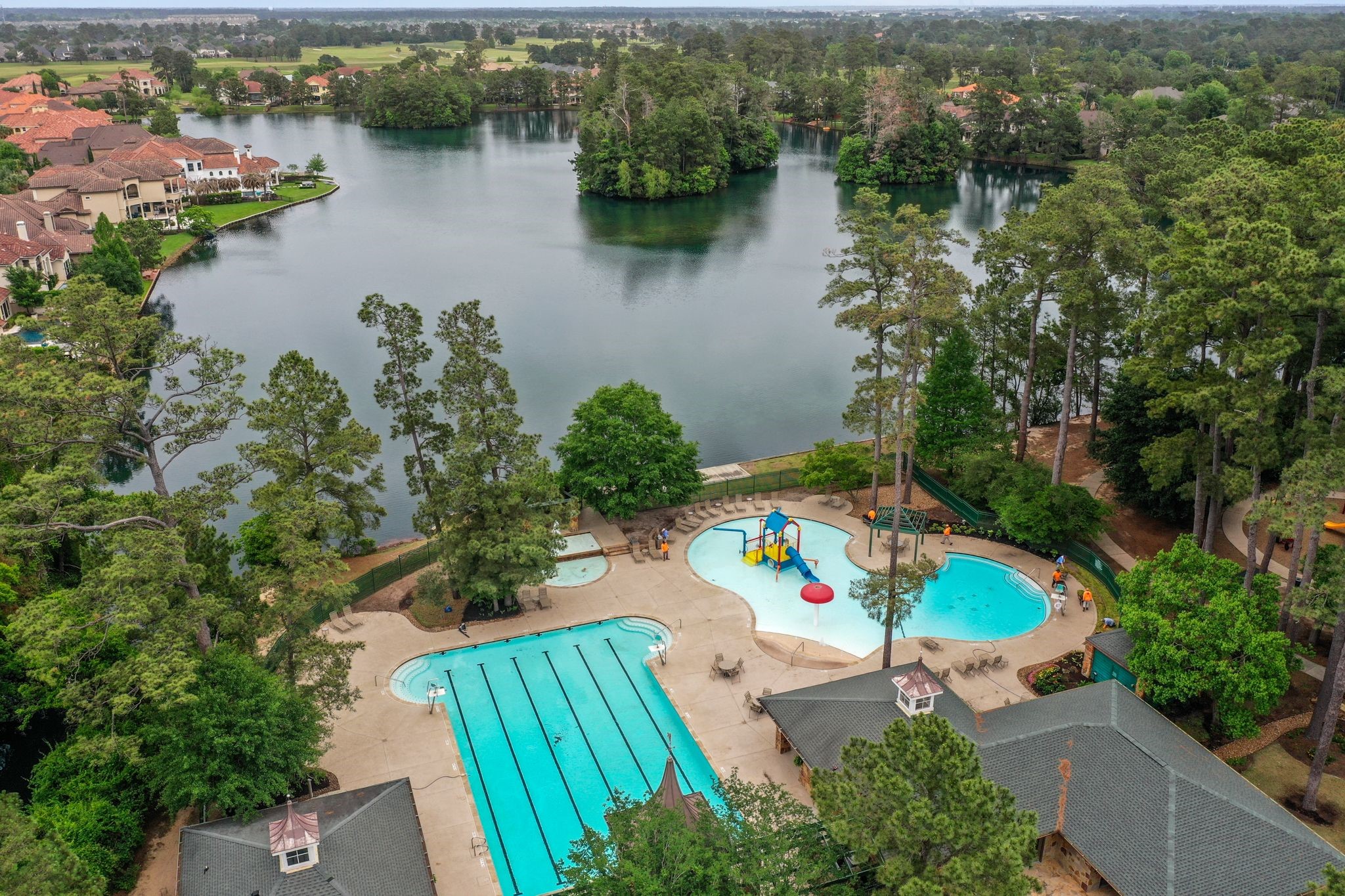 The Aquatic Complex includes an ATHLETIC POOL #1: 8-lane 25-yard competition pool. Home of the Gleannloch Gators swim team, Masters Swim Program & PACK Training Program as well as swimming lessons are offered.  A RECREATION CENTER POOL #2: includes an adult pool and kiddie activity pool with water features. THE BLUFF POOL #3 a lazy pool.
