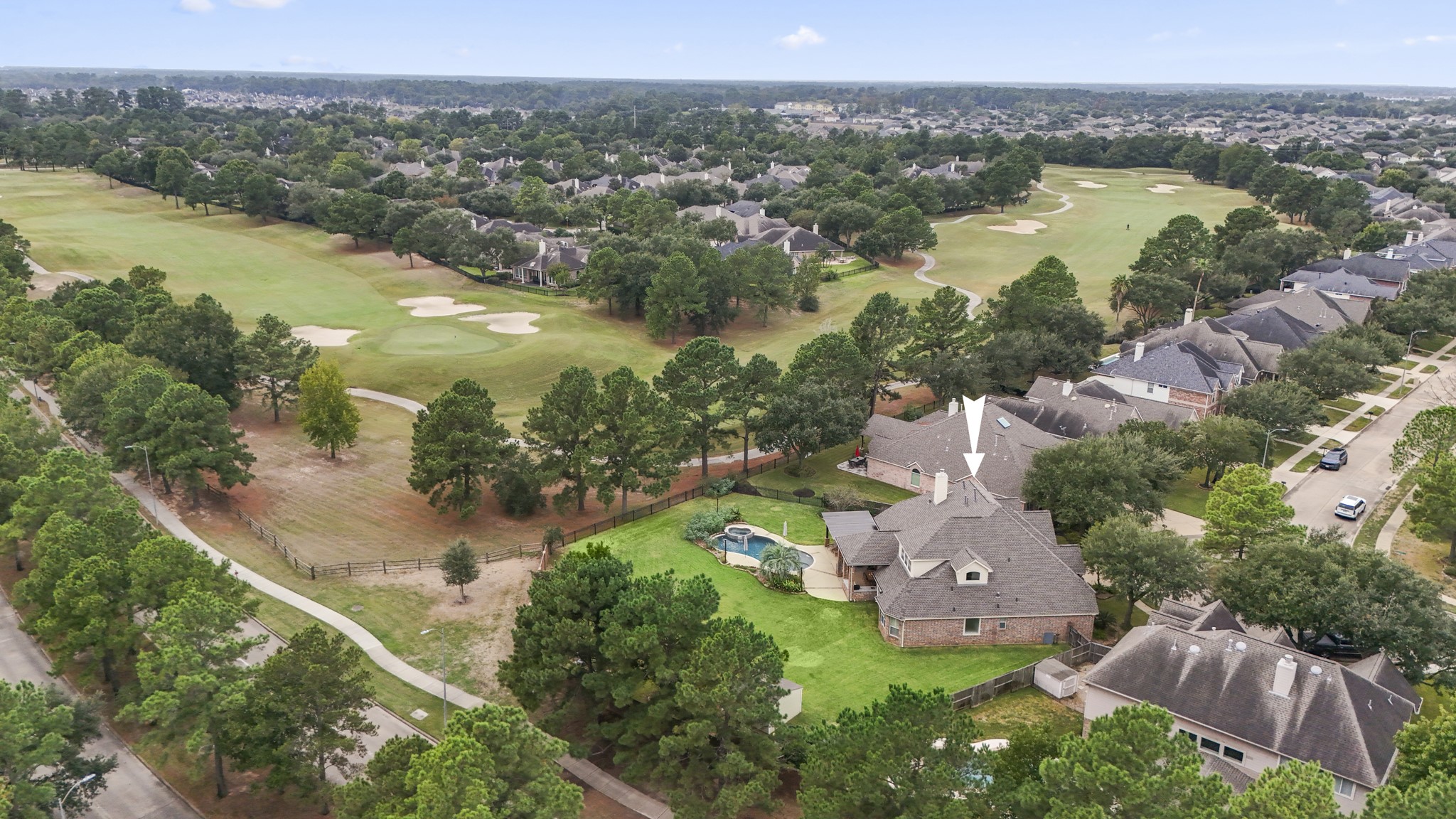 A large expansive backyard with wrought iron fence that allows you to enjoy fabulous views of Gleannloch Farms Golf Course.