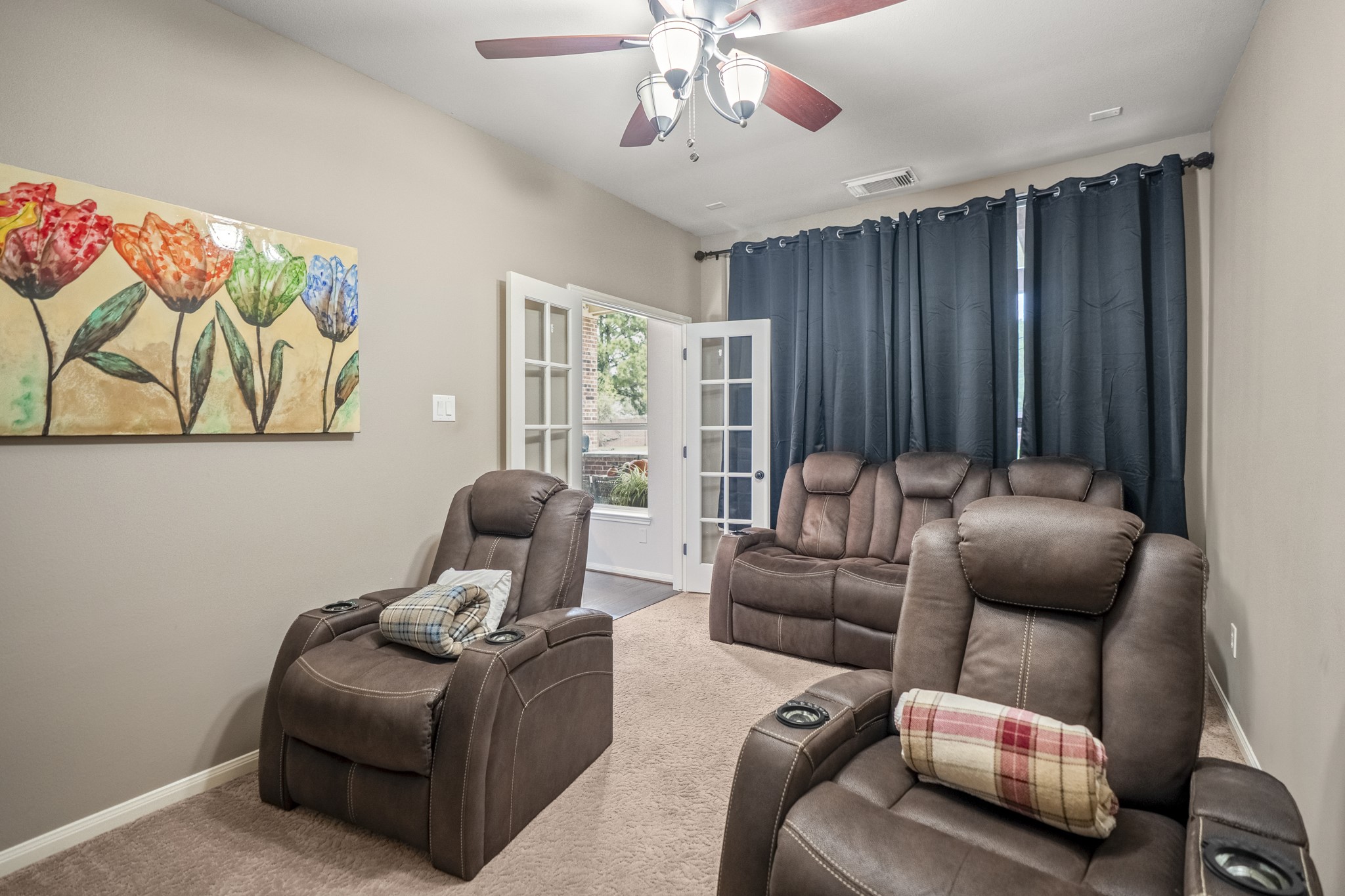 French doors lead to the media room, this could be a flex space for your family to use as your needs require.