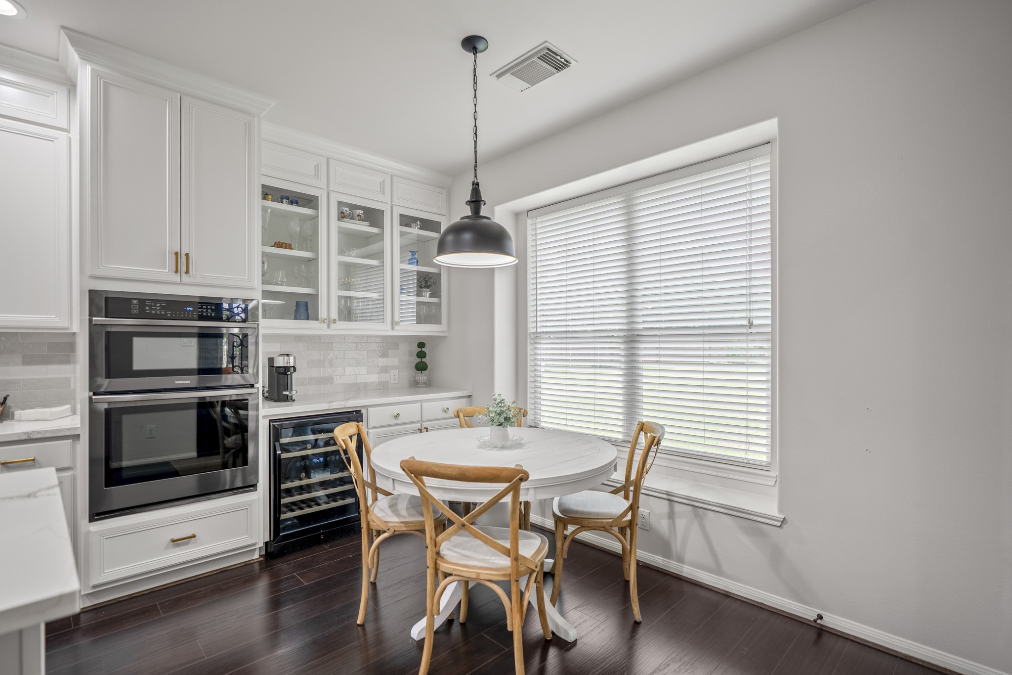 The large window floods the breakfast room with natural light, creating a warm and welcoming space to start your morning.