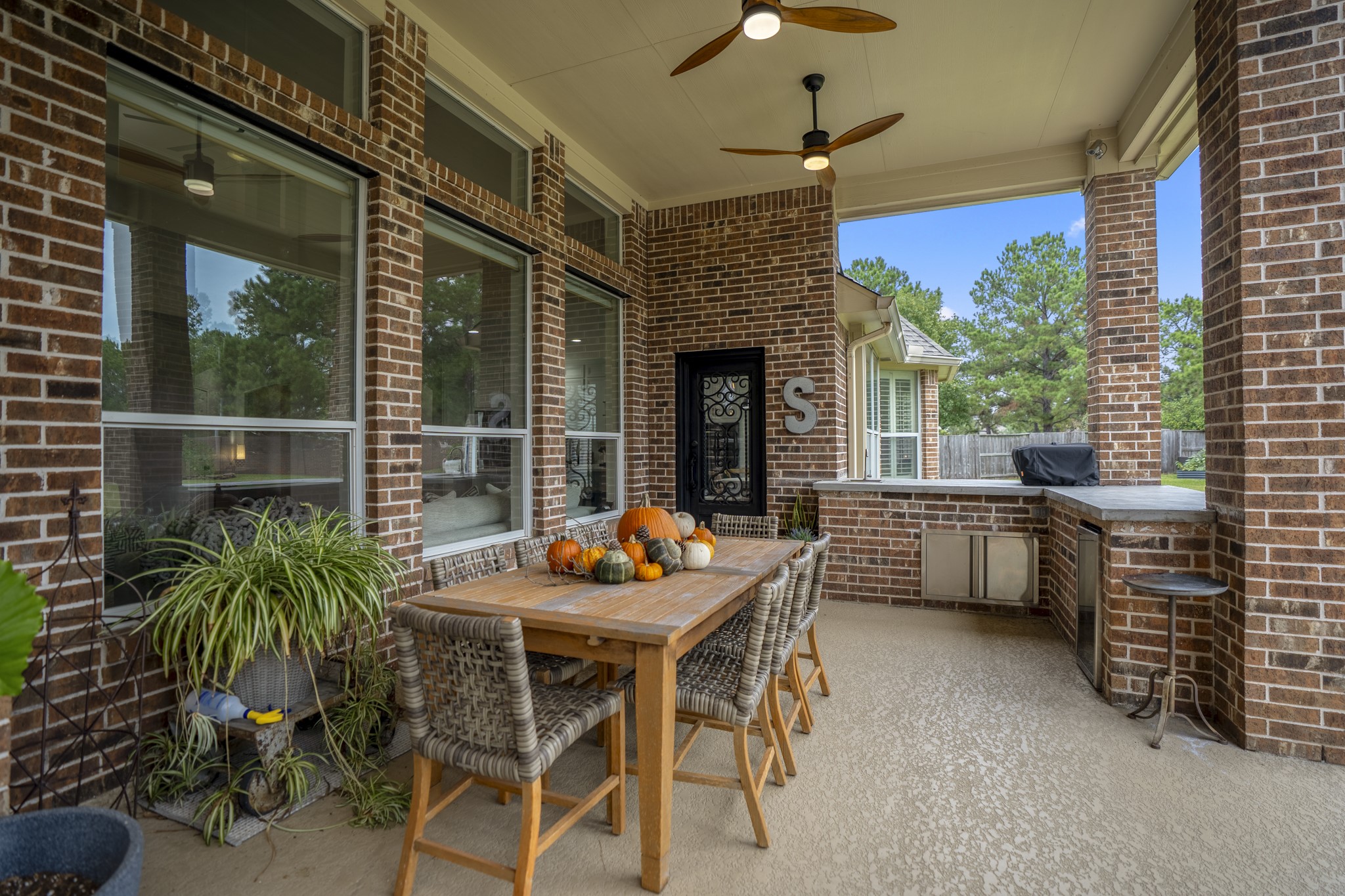This is more than a beautiful home its where special moments take shape - notice the custom wrought iron back door is cohesive with the front iron door (and surround). A real special feature.