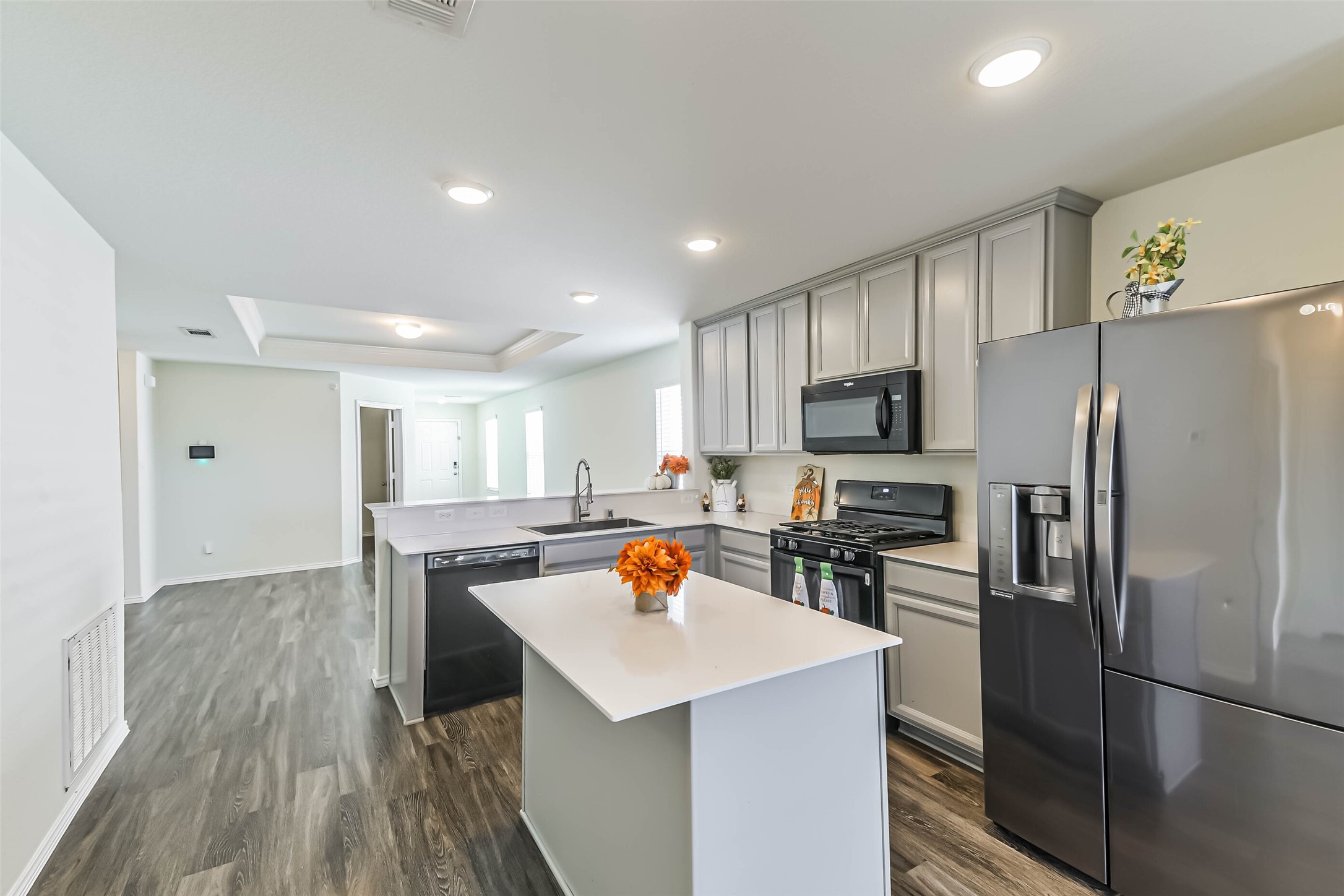 View of Kitchen area into Living area