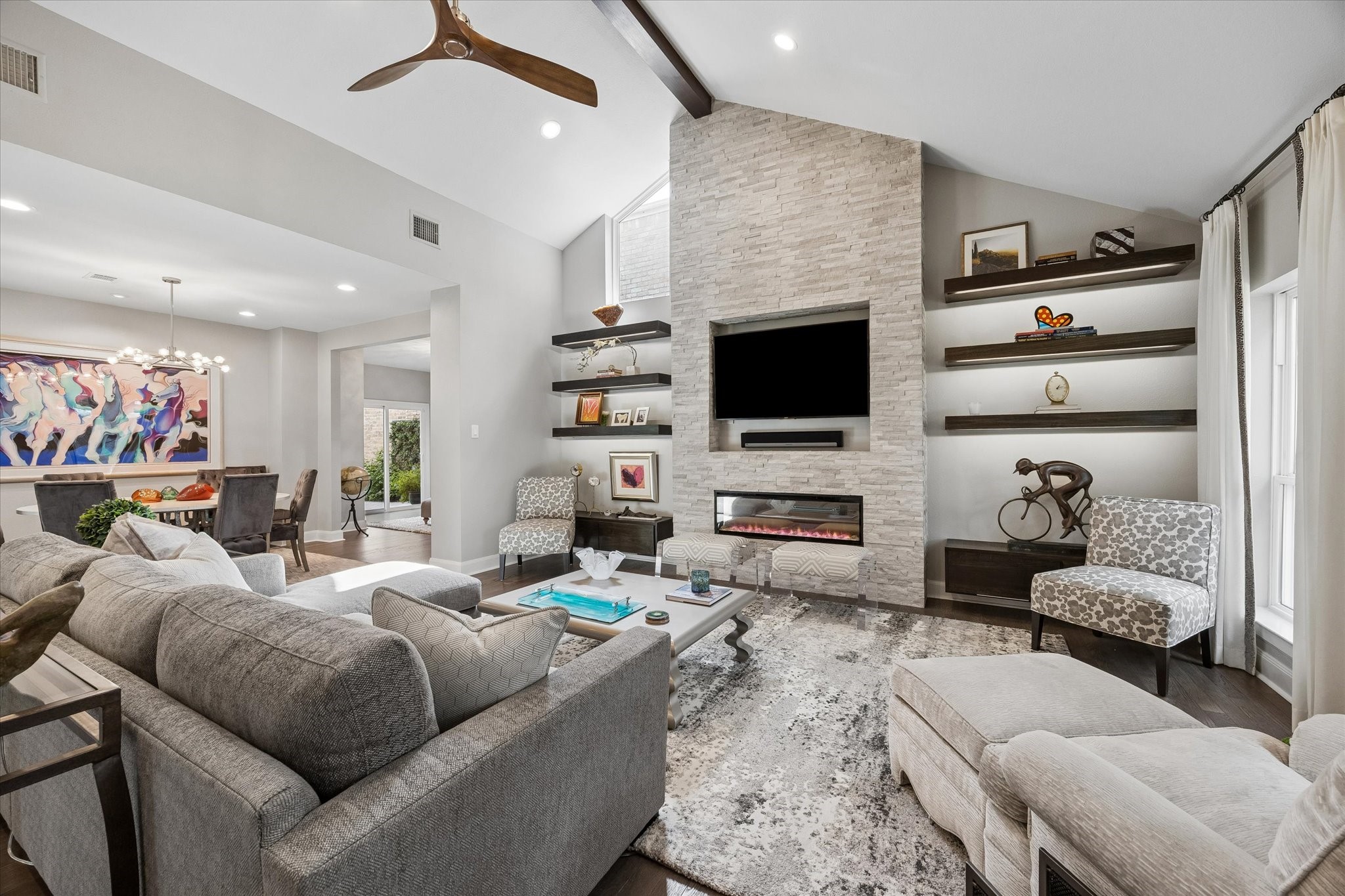LIVING ROOM II: This light and bright living area is open to the kitchen and dining area which makes it the perfect space for entertaining.