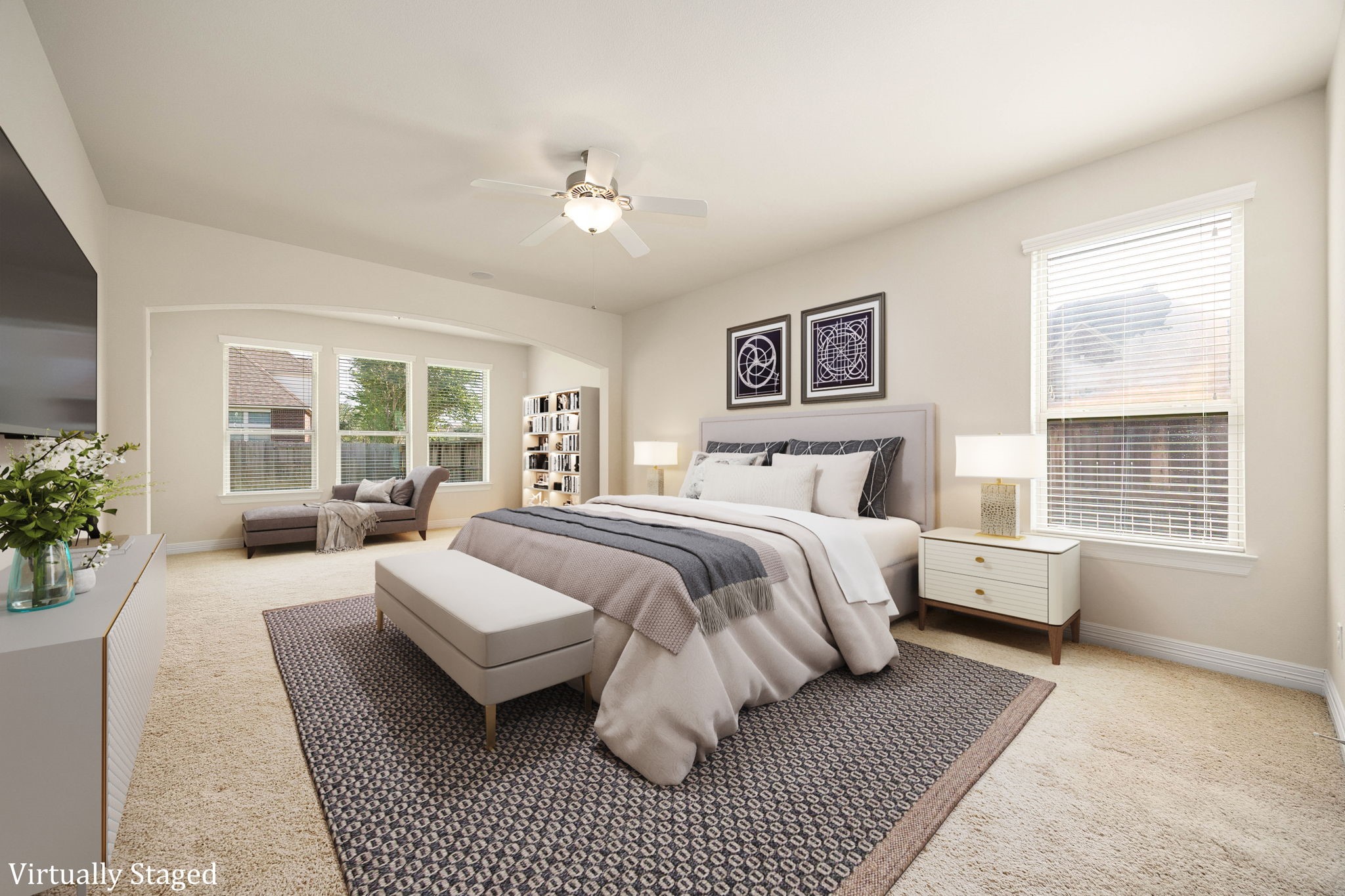 Generously sized primary suite downstairs with additional sitting areas is a welcoming retreat!(Virtually staged to showcase the rooms size and possibilities)
