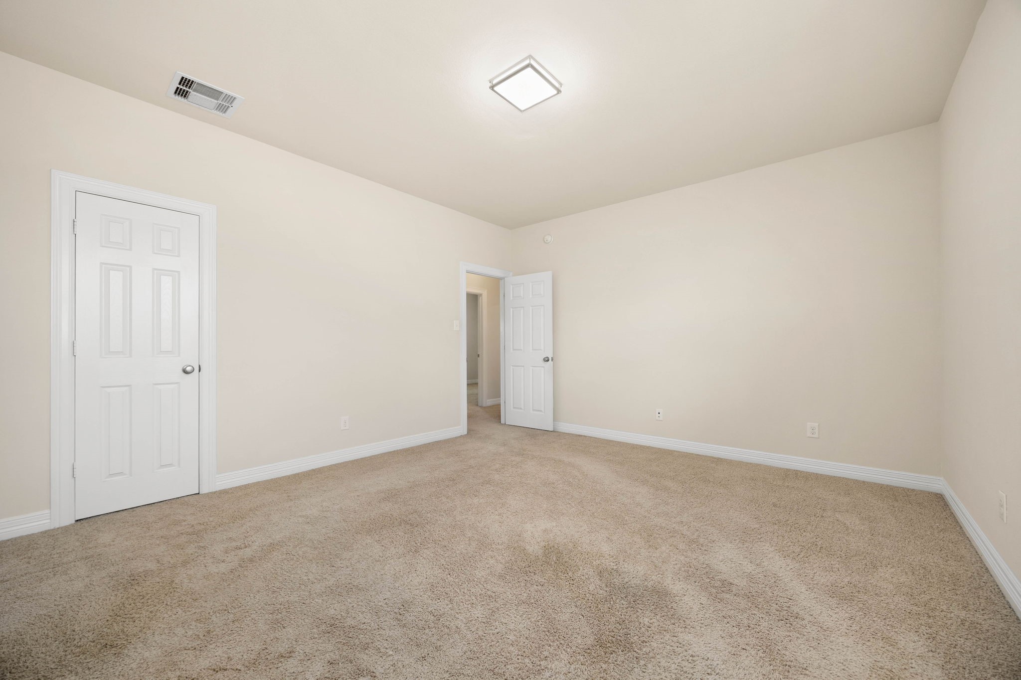 This generously sized bedroom is one of three secondary bedrooms with spacious walk-in closets which are off one side of the game room from the second primary suite.