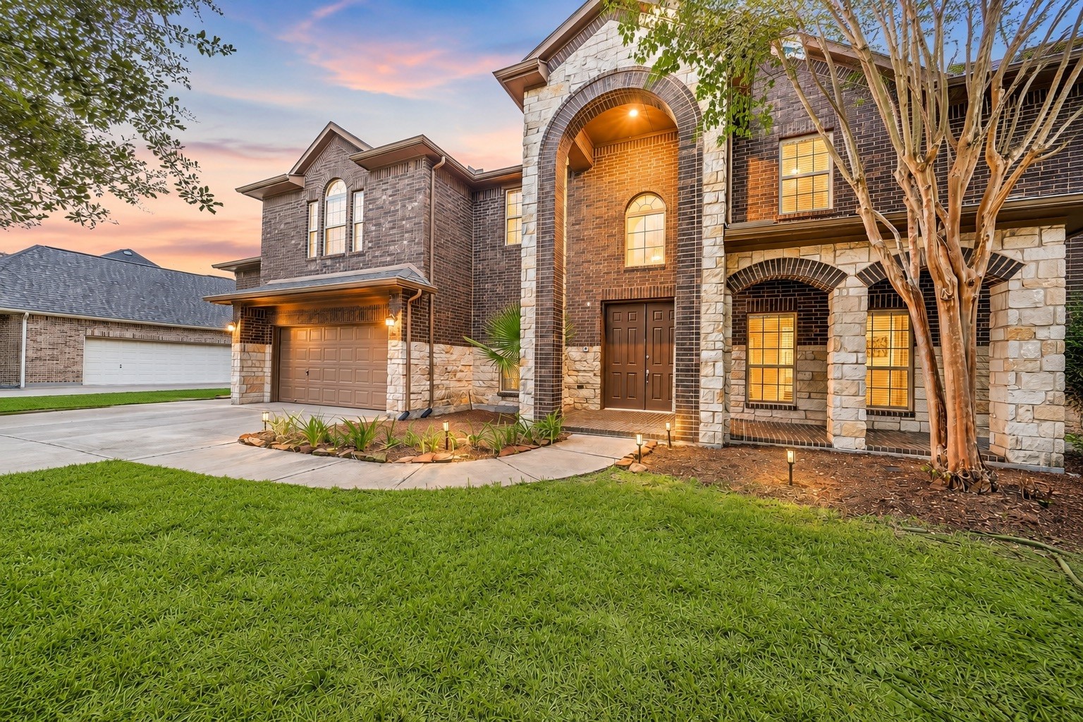 A stately brick
exterior, stone accents, a rare front porch, 
mature landscaping, and an attached 3
car garage with a raised area for outdoor or seasonal storage