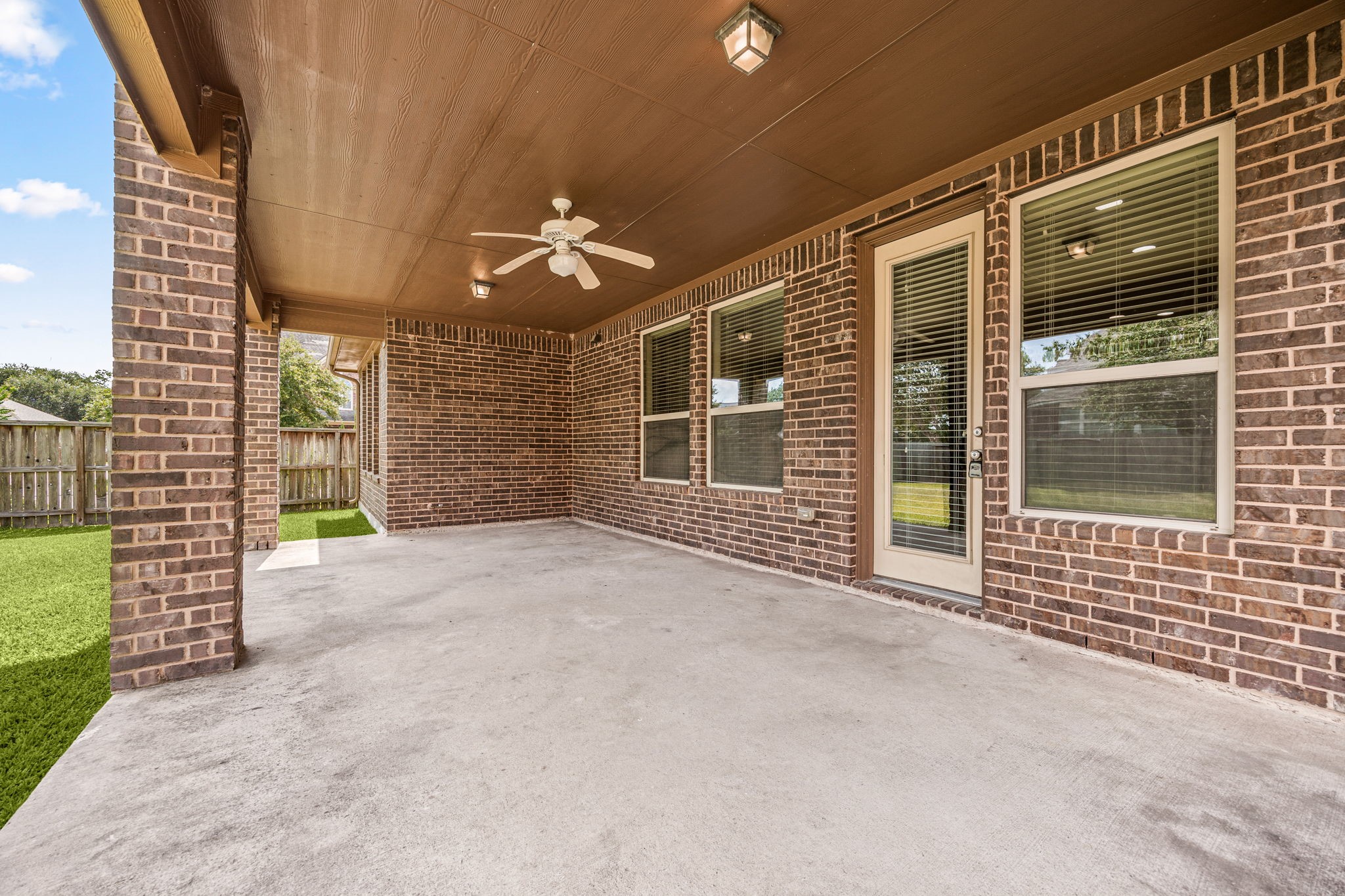 The oversized covered patio downstairs is ready for your grill!