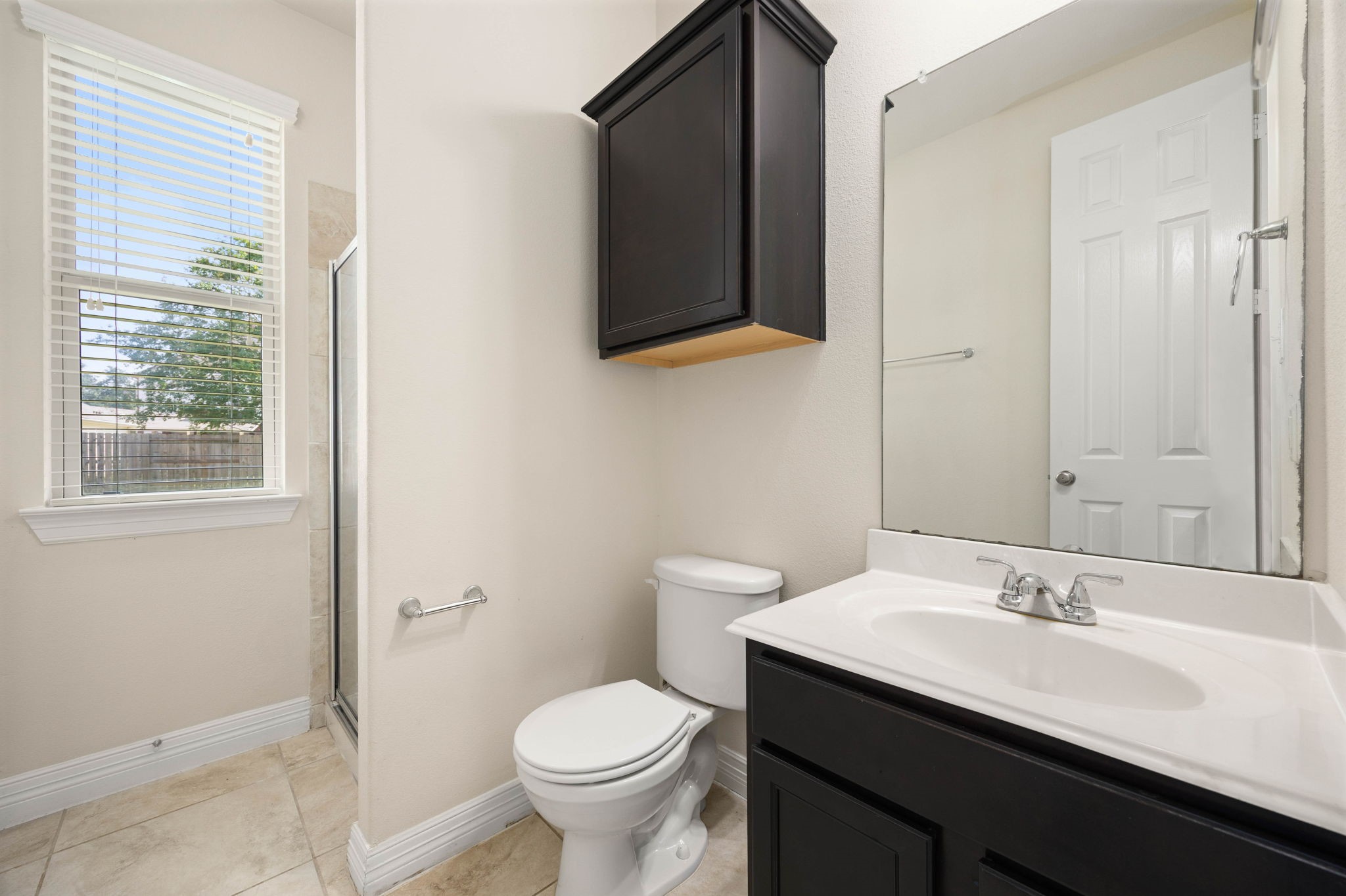 Full guest bathroom with large linen closet is convenient to the guest room and other visitors to your home.