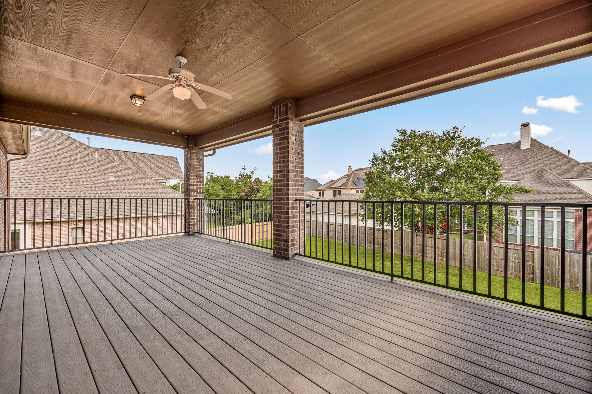 Spacious covered second-floor deck has
plenty of room for multiple seating and is an ideal outdoor
retreat for relaxing, entertaining, and enjoying views of the backyard.