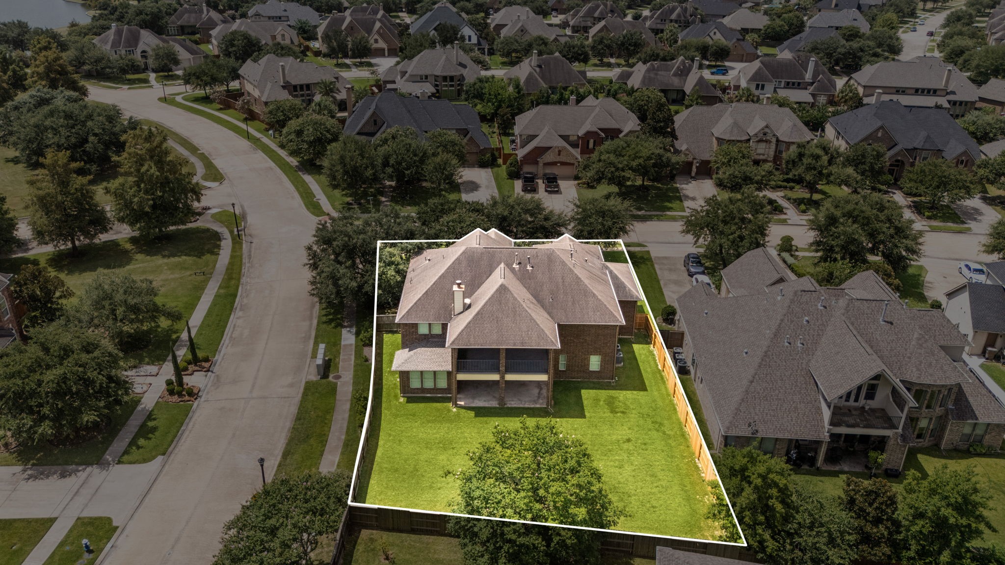 Aerial view highlights the homes impressive corner lot, large fenced backyard, and substantial outdoor space!  This home is also steps from the mailbox central area.