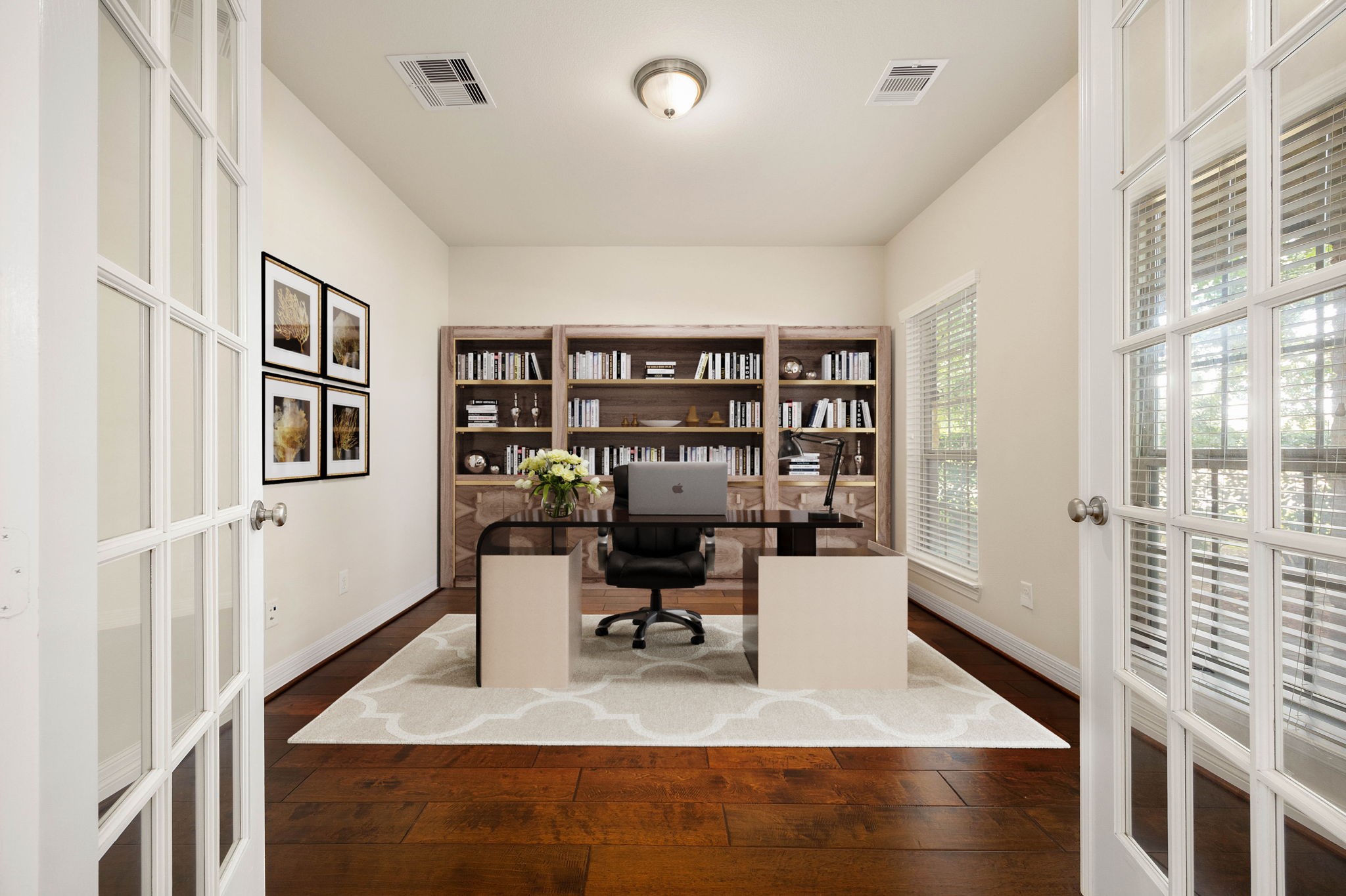 Dedicated home office or flex room with French doors and windows offering abundant natural light and privacy for a comfortable work-from-home setup. (Virtually staged to showcase possibilities)