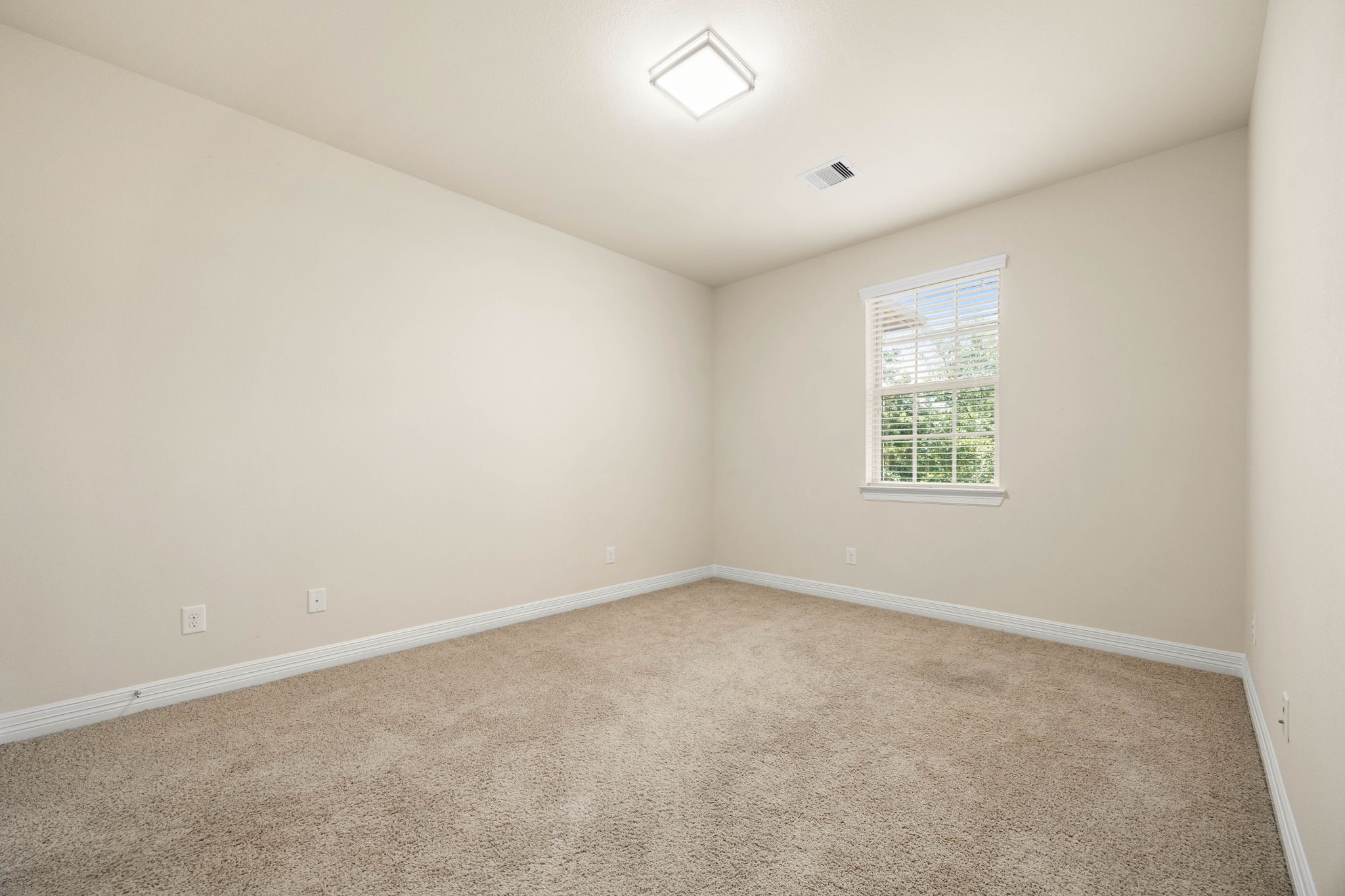 The third upstairs secondary bedroom...all three of which are off a hallway with a niche perfect for setting up a study spot, book nook, or relaxing space.