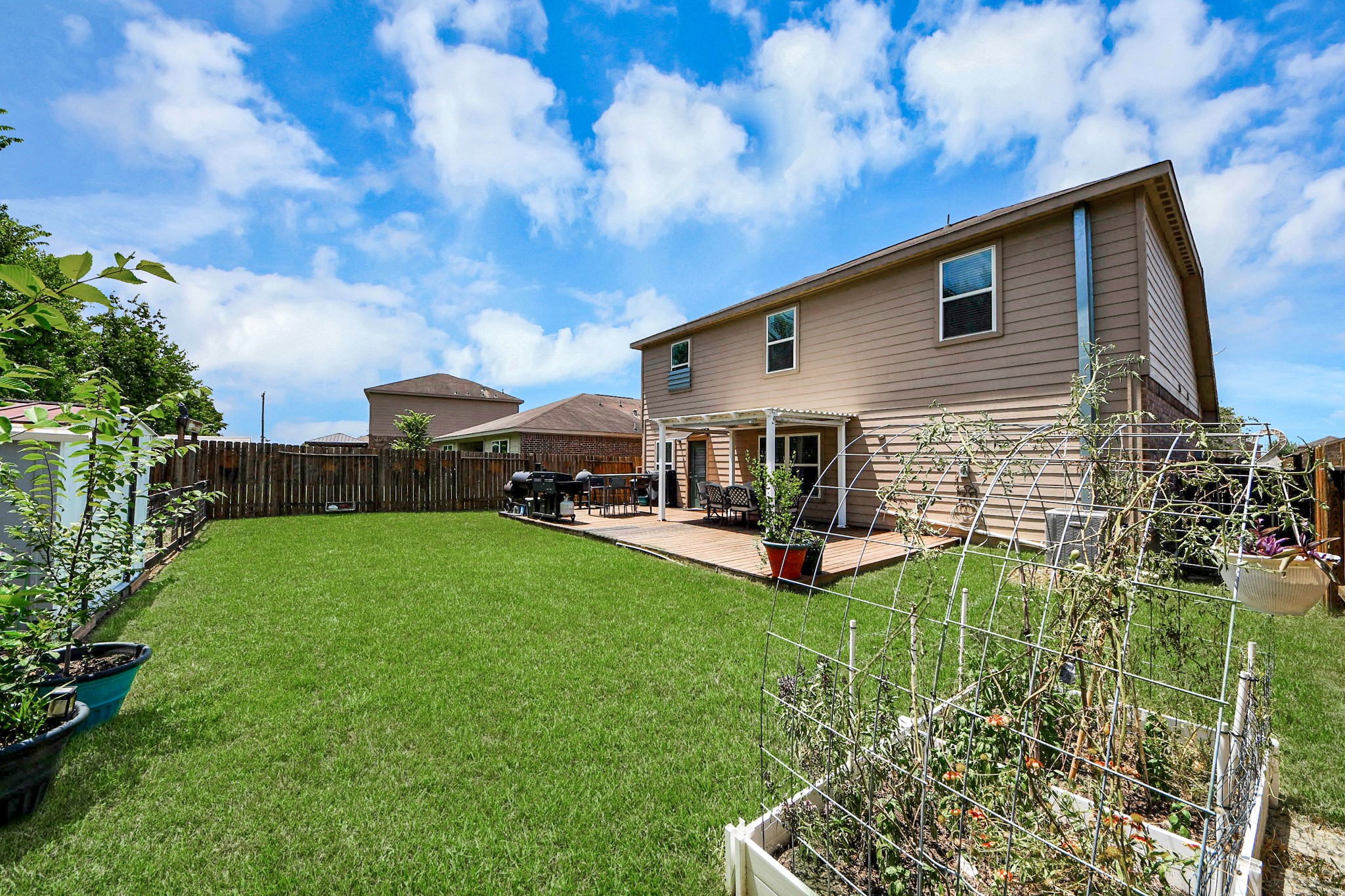 View from corner of the home. Spacious yard
