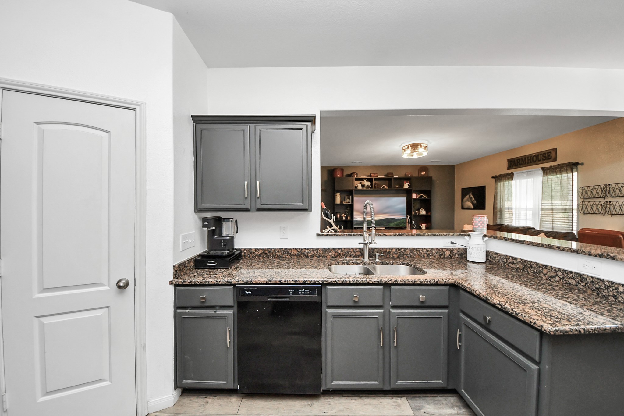 L shape island open concept, with living area and dining.