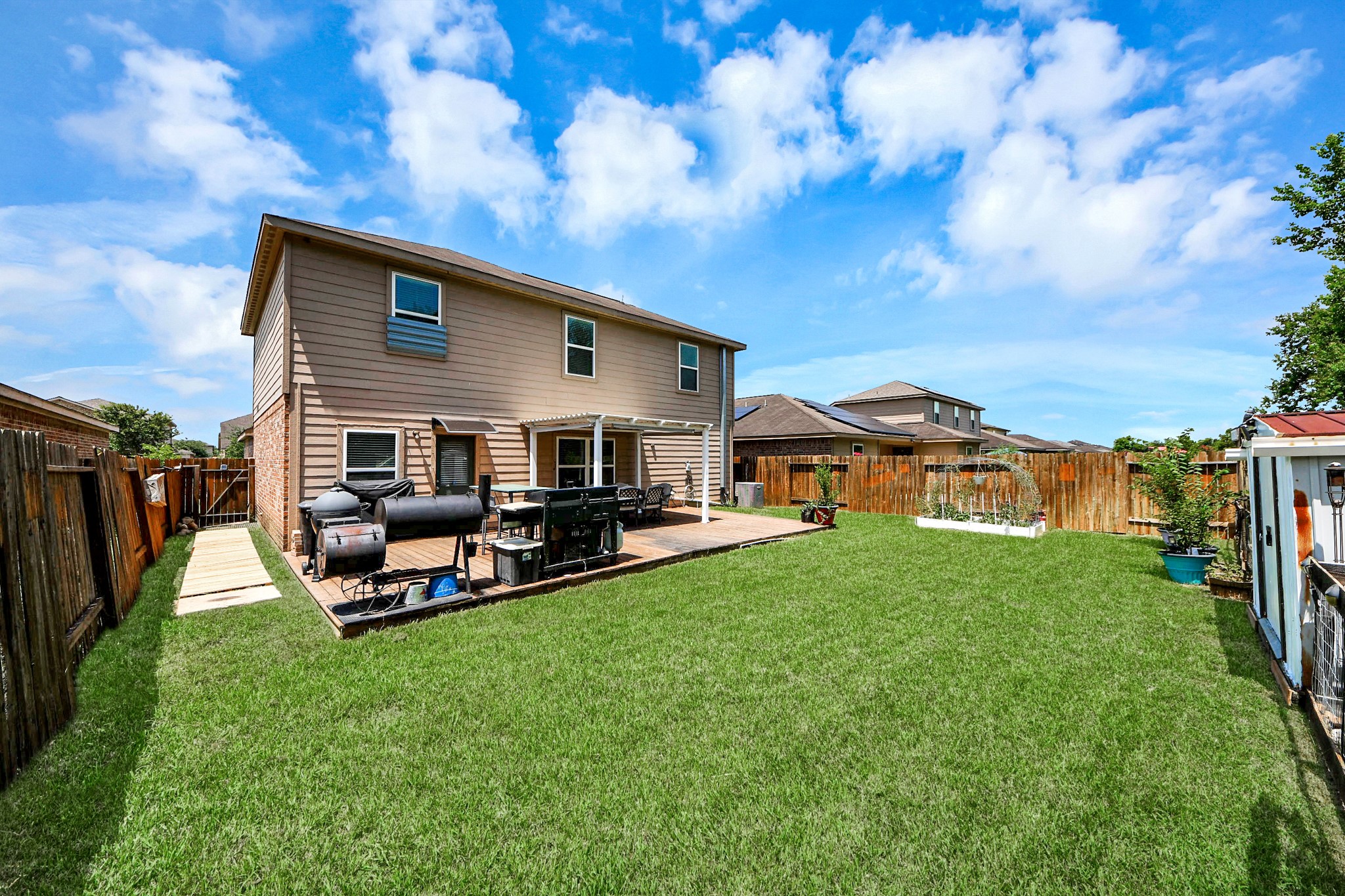View from corner of the home. Spacious yard