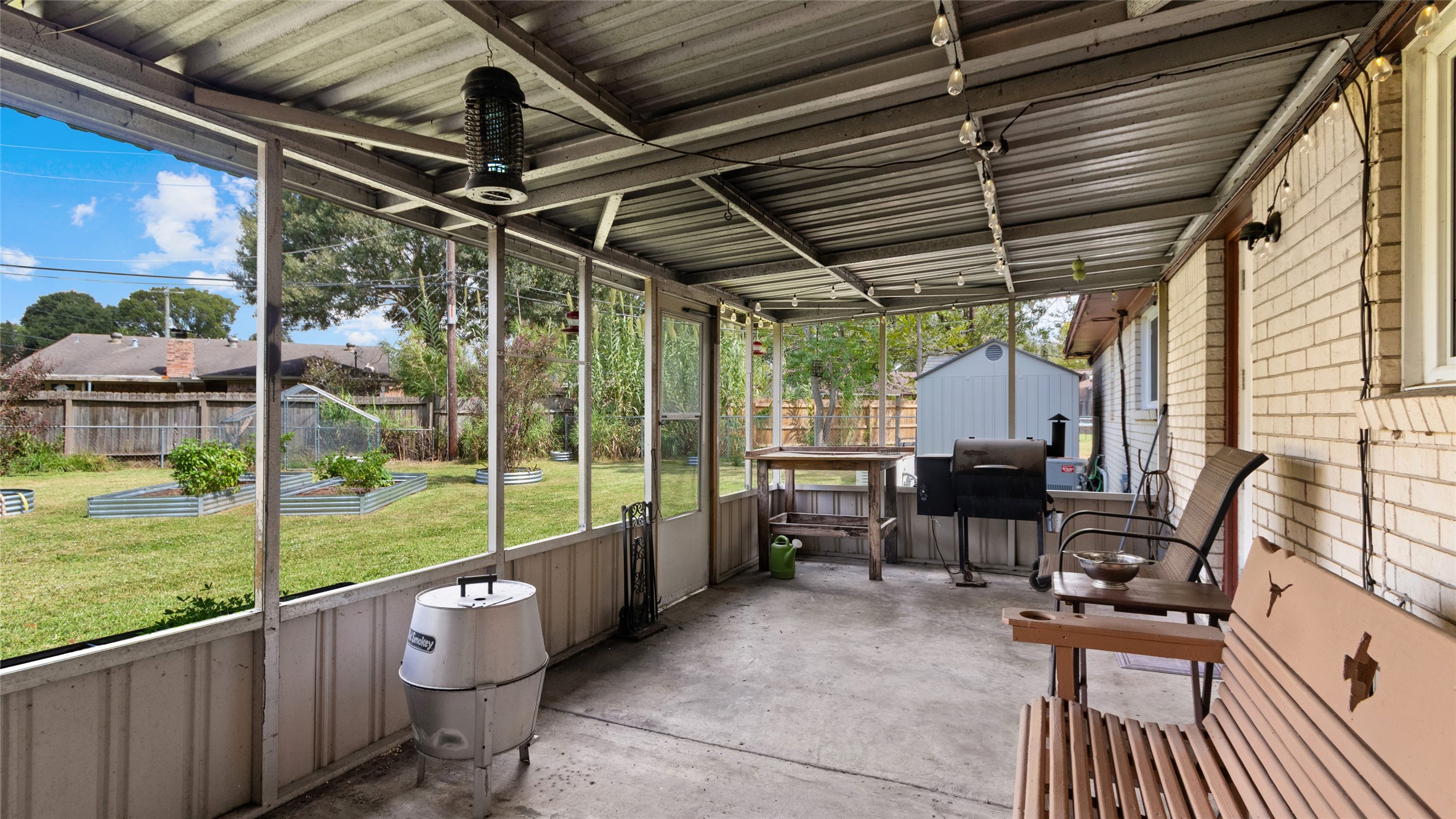 Another view of the expansive covered and screened patio, offering plenty of room for outdoor living and entertaining with direct access to the backyard.