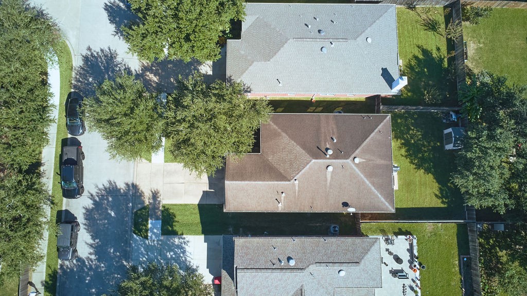 Discover the property from above! An elevated perspective highlights the home and its surrounding residential setting.