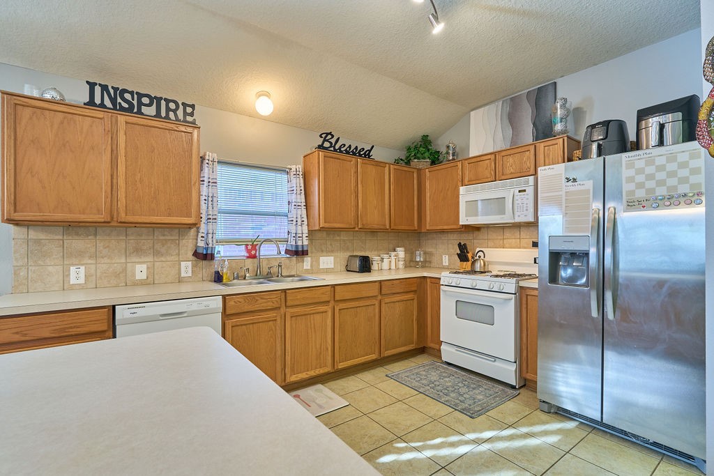 Cook, gather, and create memories in this welcoming kitchen with ample workspace and convenient storage. Cook, gather, and create memories in this welcoming kitchen with ample workspace and convenient storage.