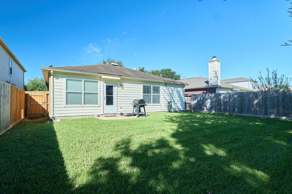 Your outdoor escape awaits! Enjoy a spacious, fully fenced backyard with room for relaxation and recreation.