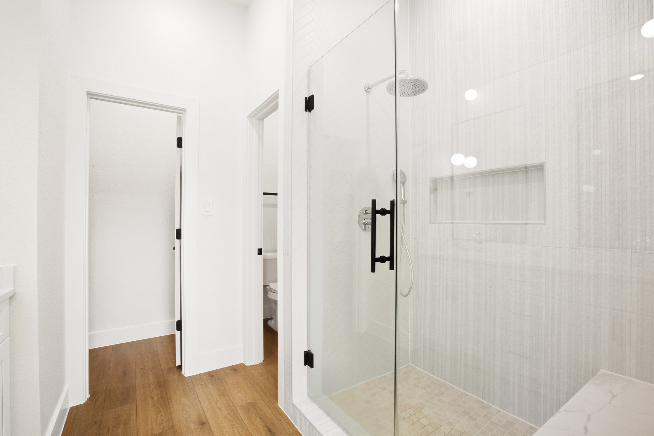 Modern bathroom with a glass-enclosed shower and clean detailing.