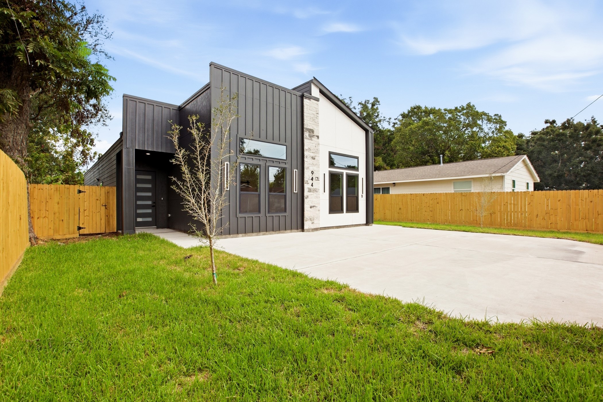 Sleek architectural design complemented by lush green surroundings.