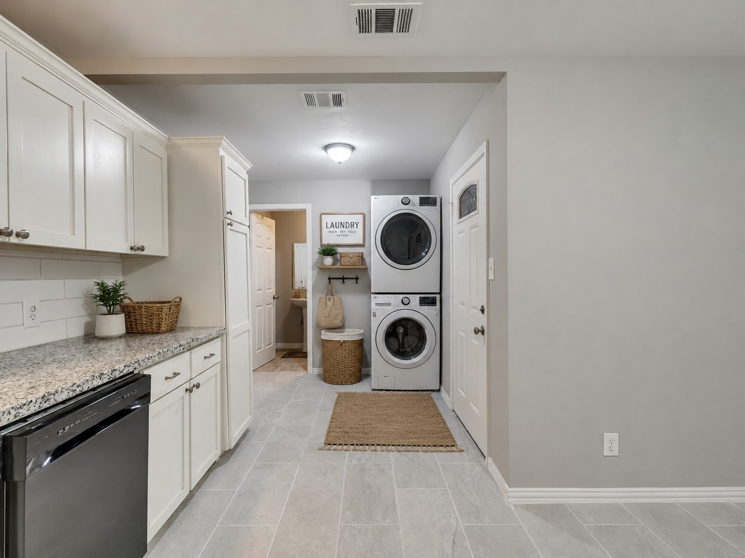 Virtually staged laundry area.
