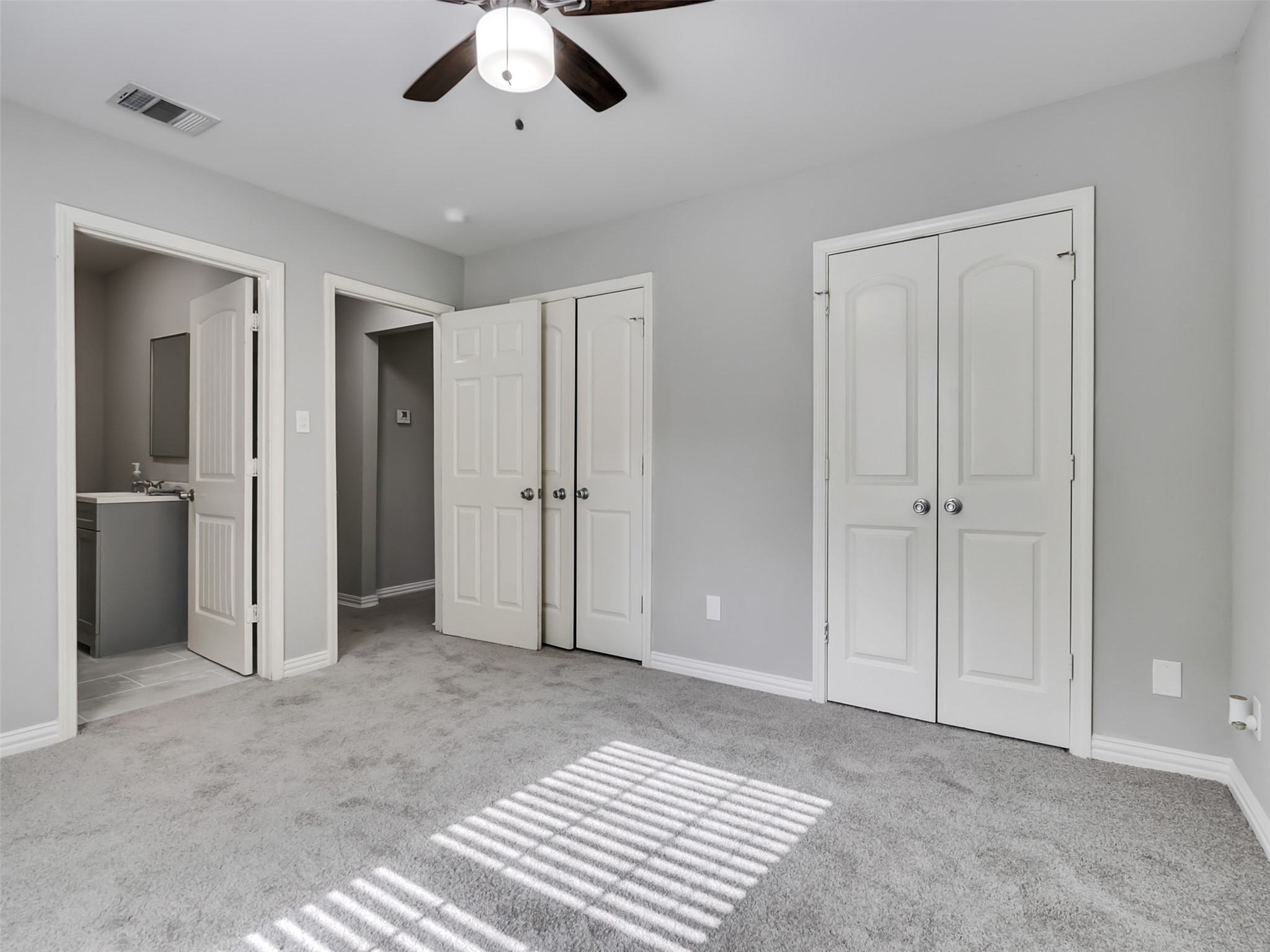 Primary bedroom with ensuite bathroom.