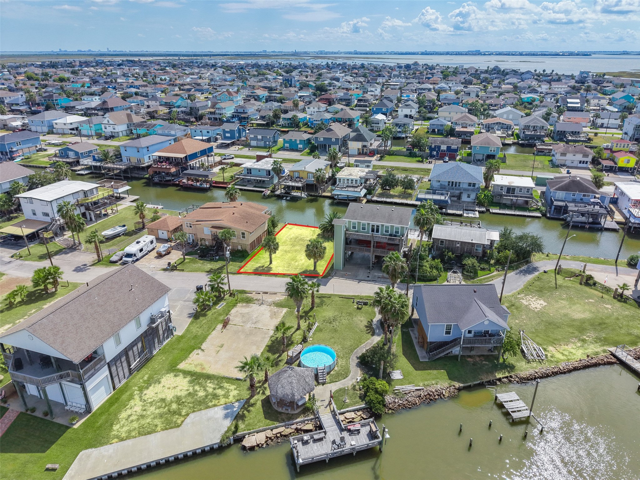 Marsh and open water in the distance are the Galveston Bay system, which is the draw out here. Airbnb rentals are allowed, so a vacation home can double as a rental when you're not using it.