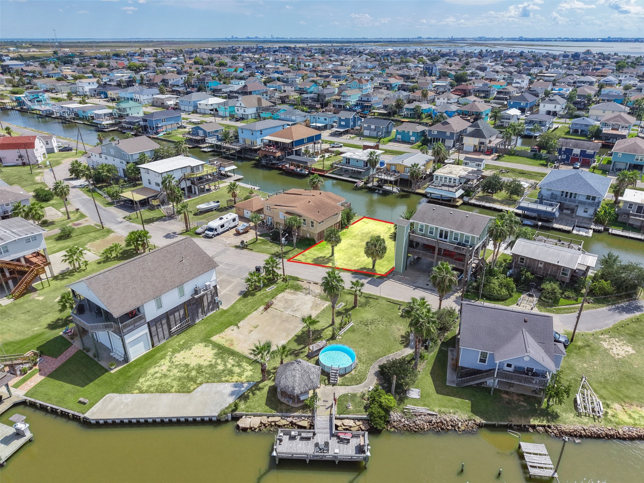 Wide over the neighborhood with the lot highlighted. Original Bayou Vista is unincorporated, with fewer permitting regulations than inside a city. No HOA!
