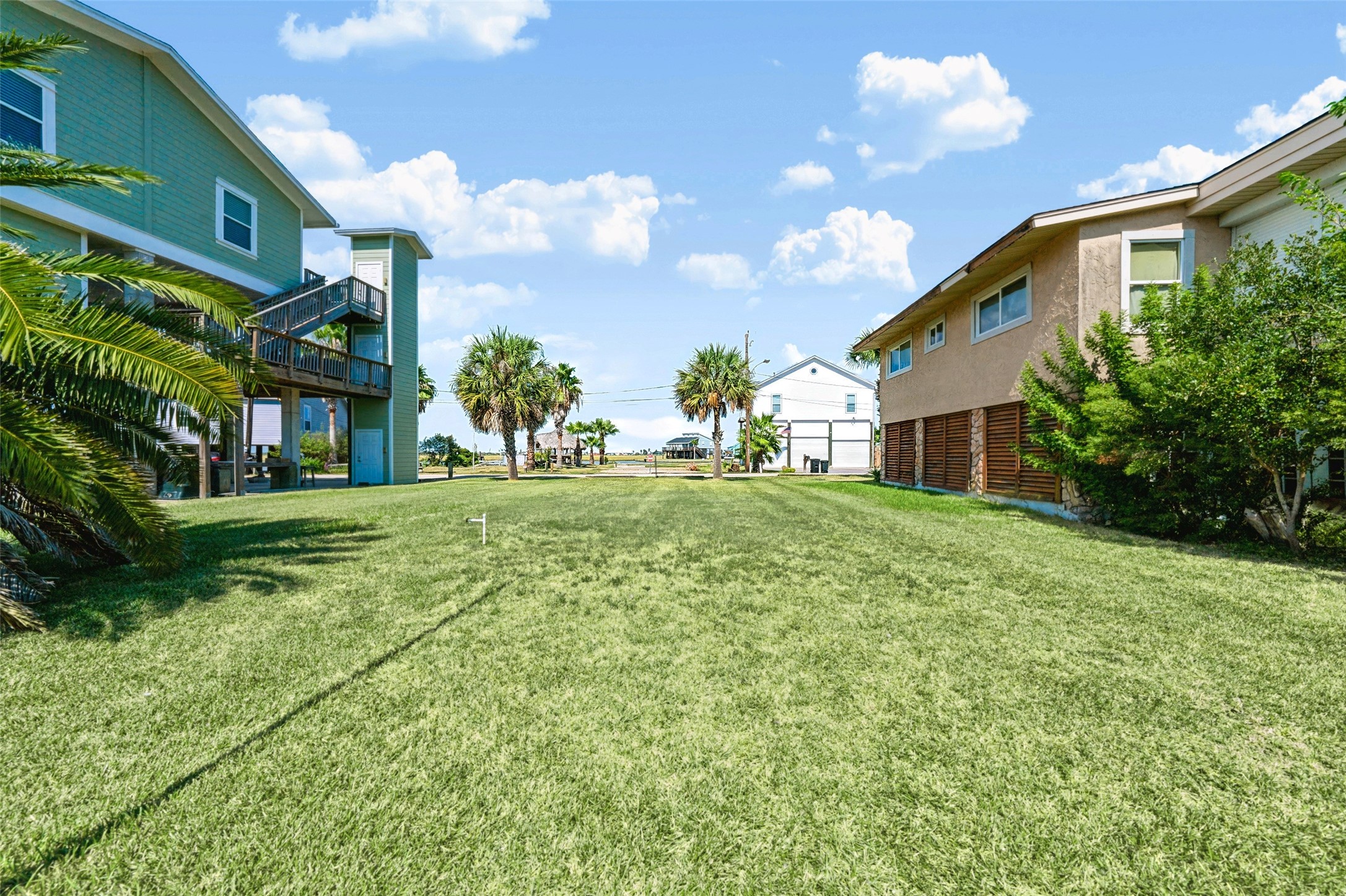 Across the cleared lot toward the neighbors. Smokin' Z's BBQ is about 0.4 miles away, and Bayou Bistro and Bar is about 0.5, so supper is always close.