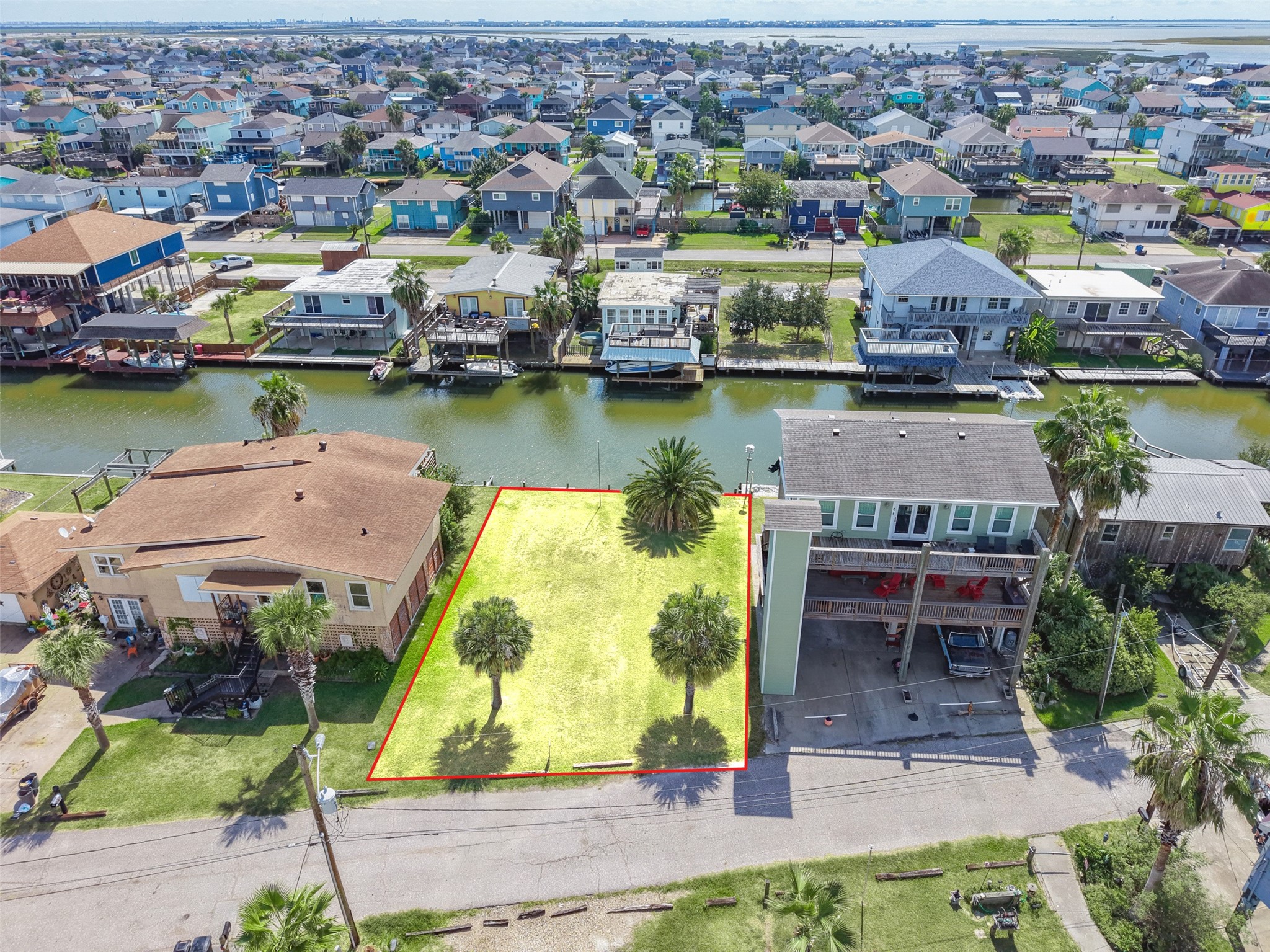 Pulled back over the canals. Bayou Vista was built along dredged canals that reach Galveston Bay and the Gulf, and from up here you can see exactly how the water threads through the neighborhood.