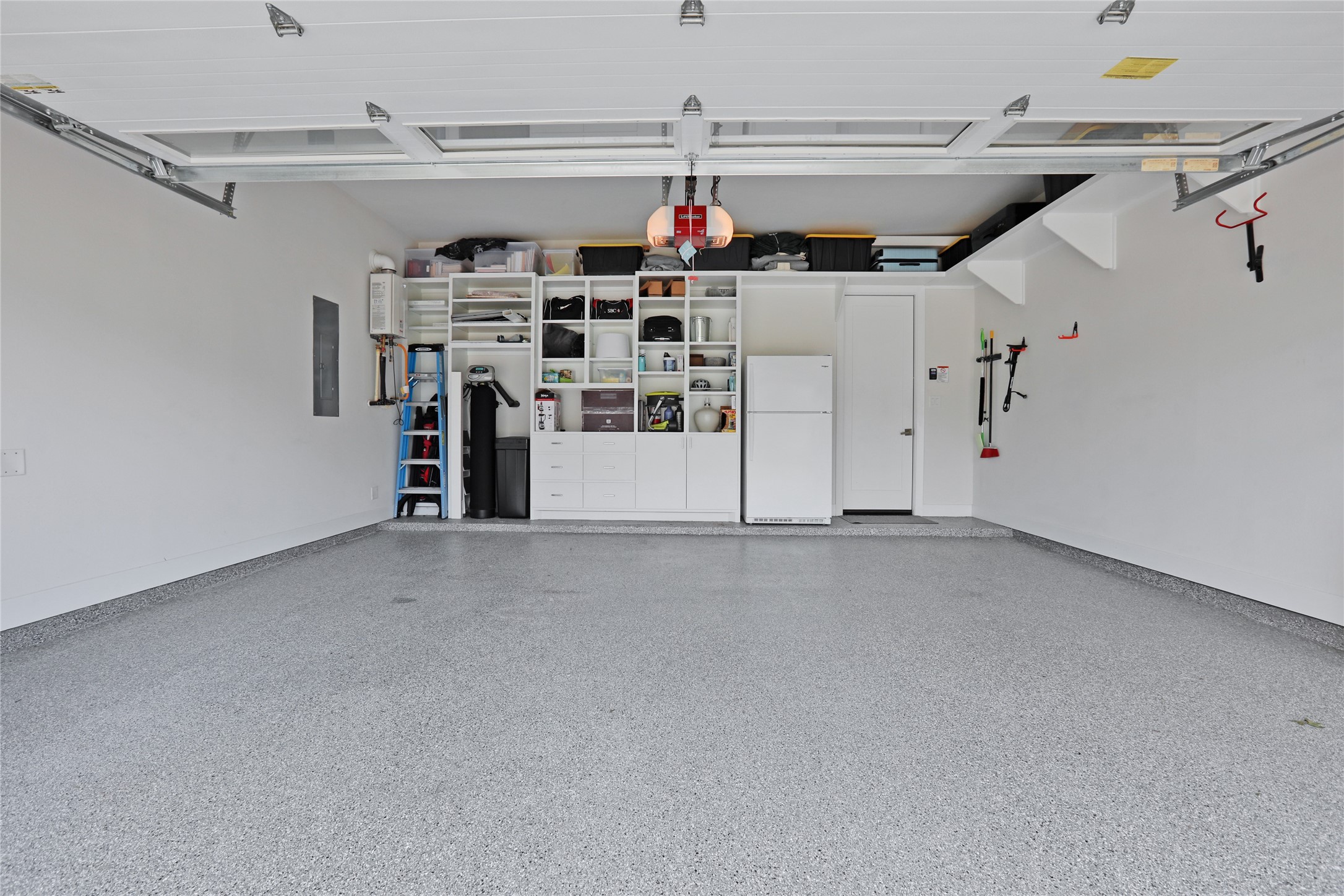 Garage Built in, drawers Shelves, doors. Also a water softener, please remember to refill with salt!