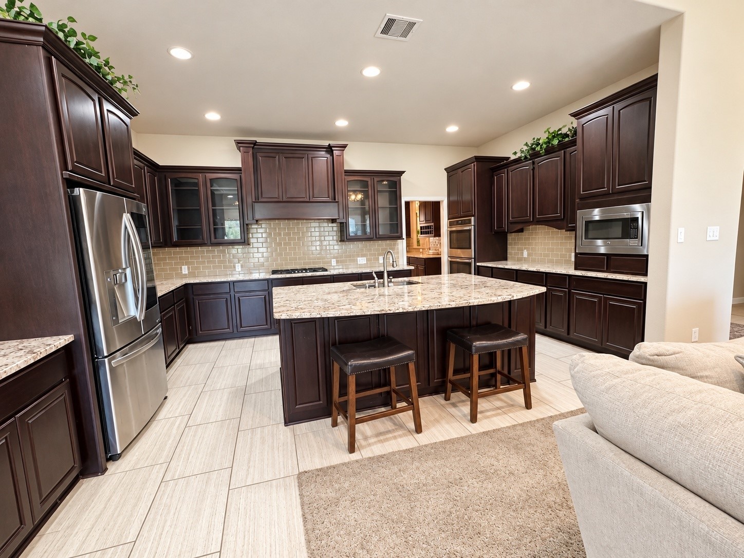 Beautifully designed serving area offering generous counter space, built-in cabinetry, and convenient storage.