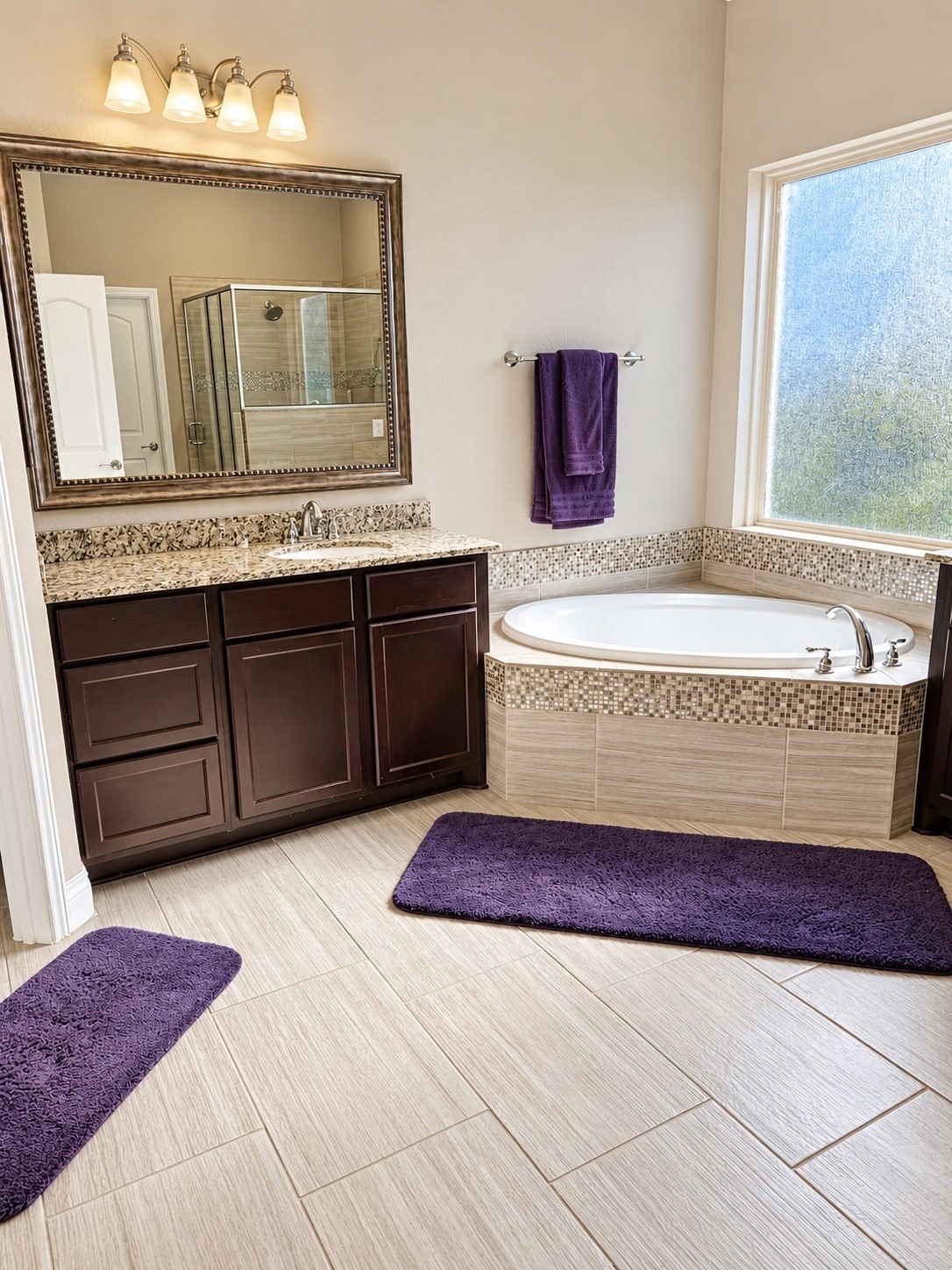 Enjoy your own private sanctuary  beautifully appointed bath that combines everyday comfort with a touch of luxury. Enjoy. your soaking tub, tiled floors and a large glass shower