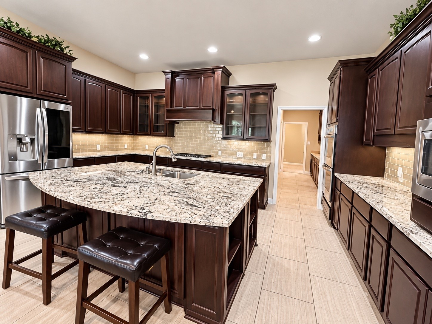 Beautifully designed serving area offering generous counter space, built-in cabinetry, and convenient storage.