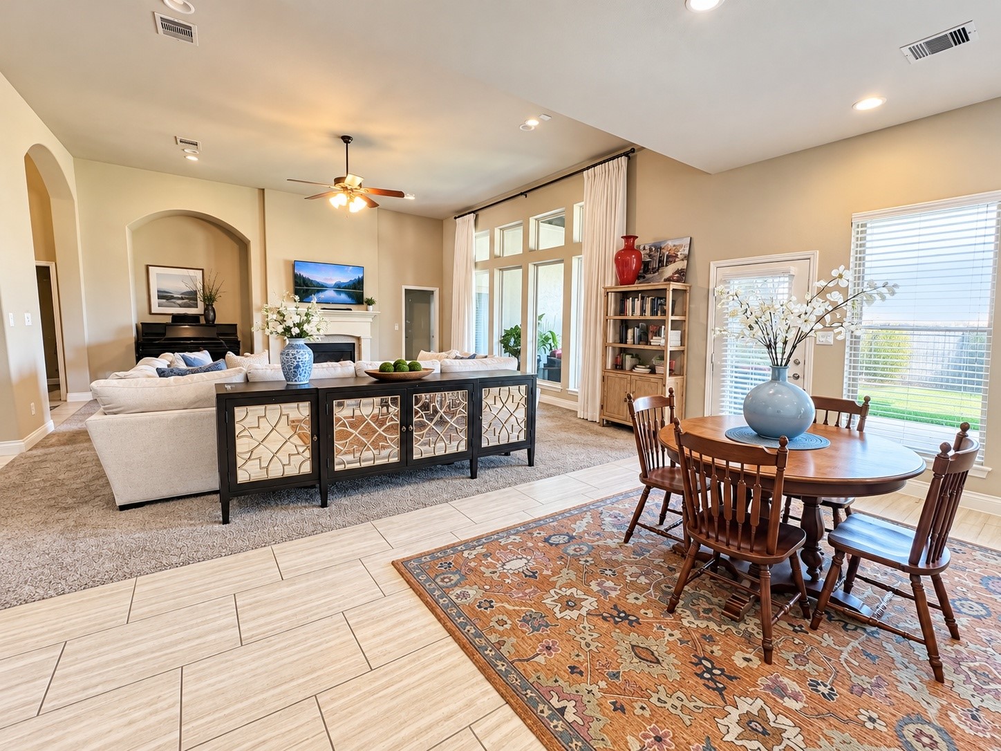 Generous family room featuring beautiful windows, a fireplace, and ample space to relax or entertain.