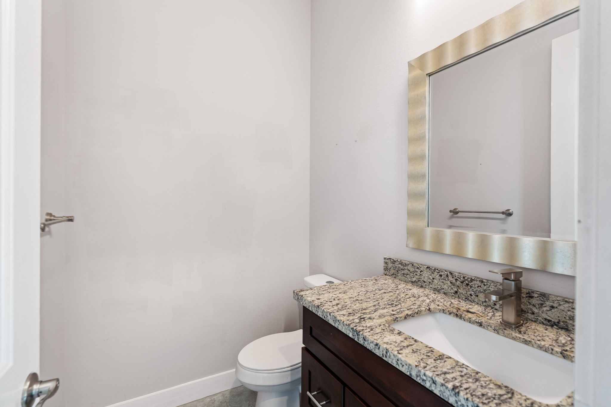 Powder bath conveniently located on the main living floor for easy guest access.