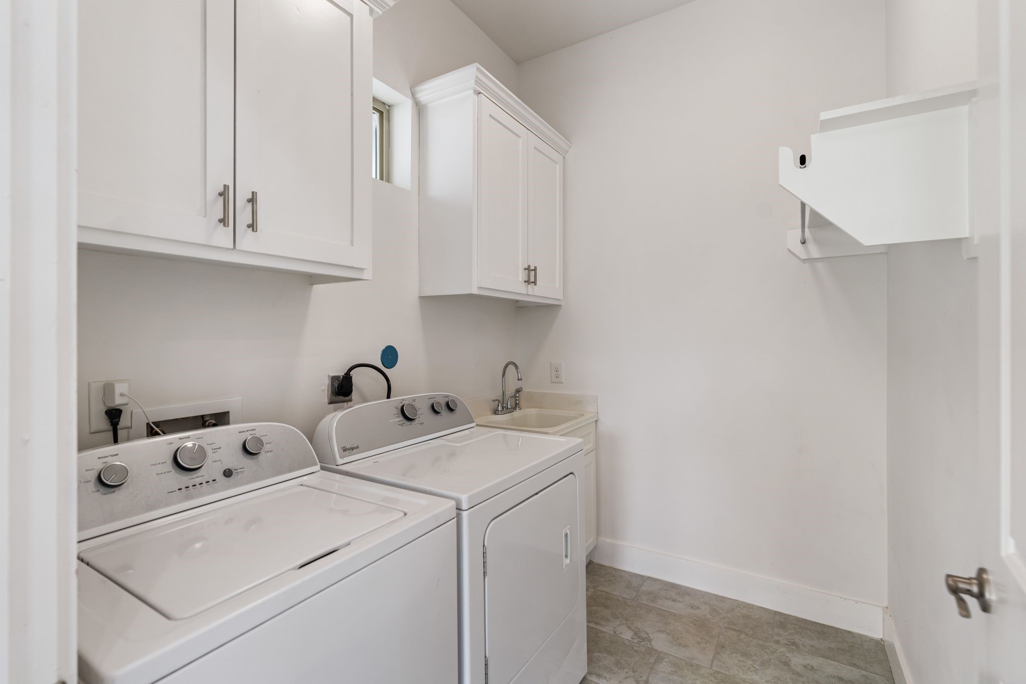 Walk in laundry room conveniently located on the second floor