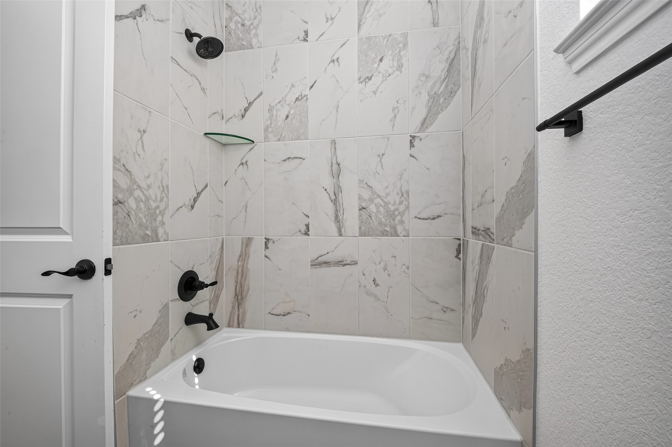 Secondary bathroom with tub and shower combo