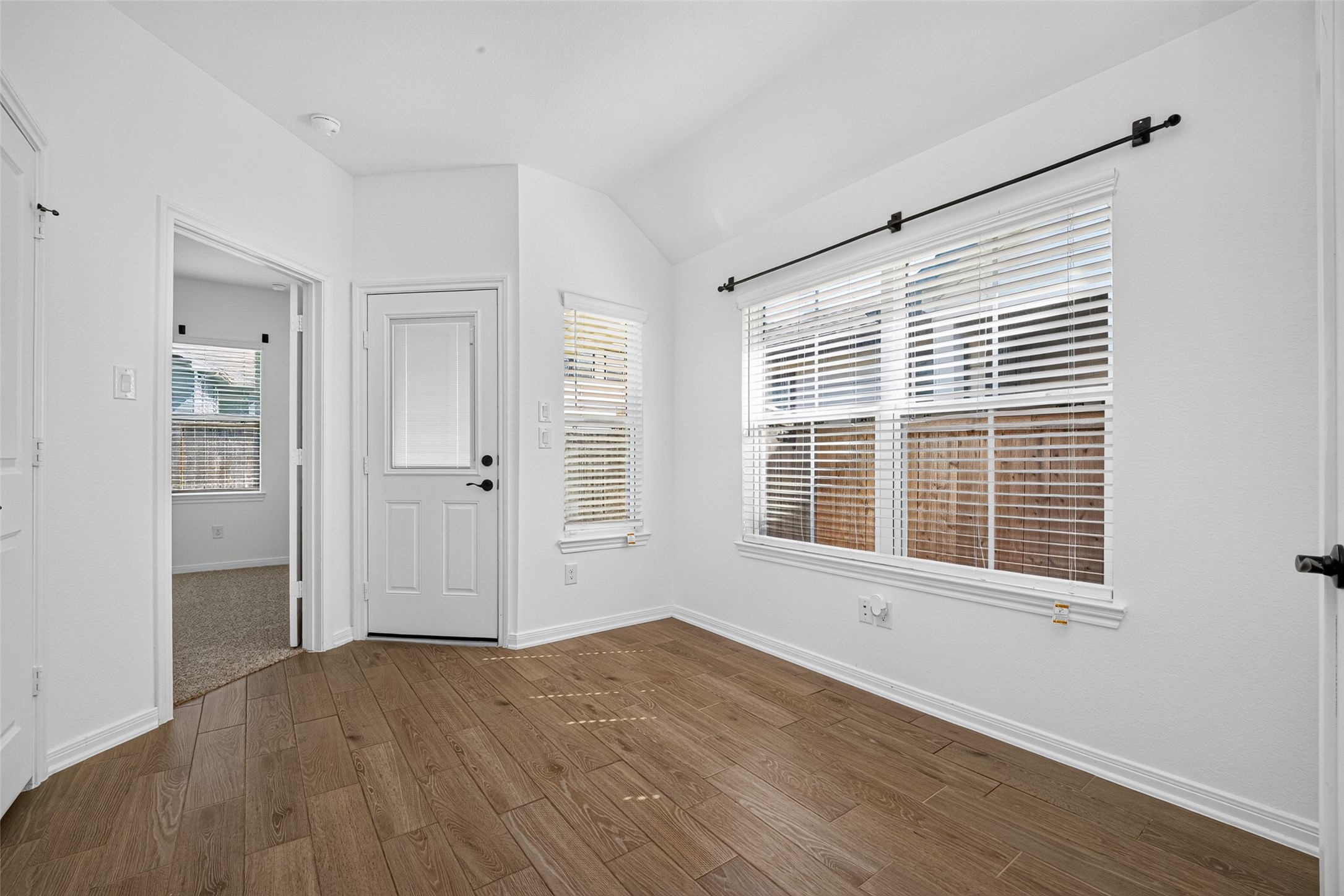 Office or study area, just before the primary bedroom and backyard door