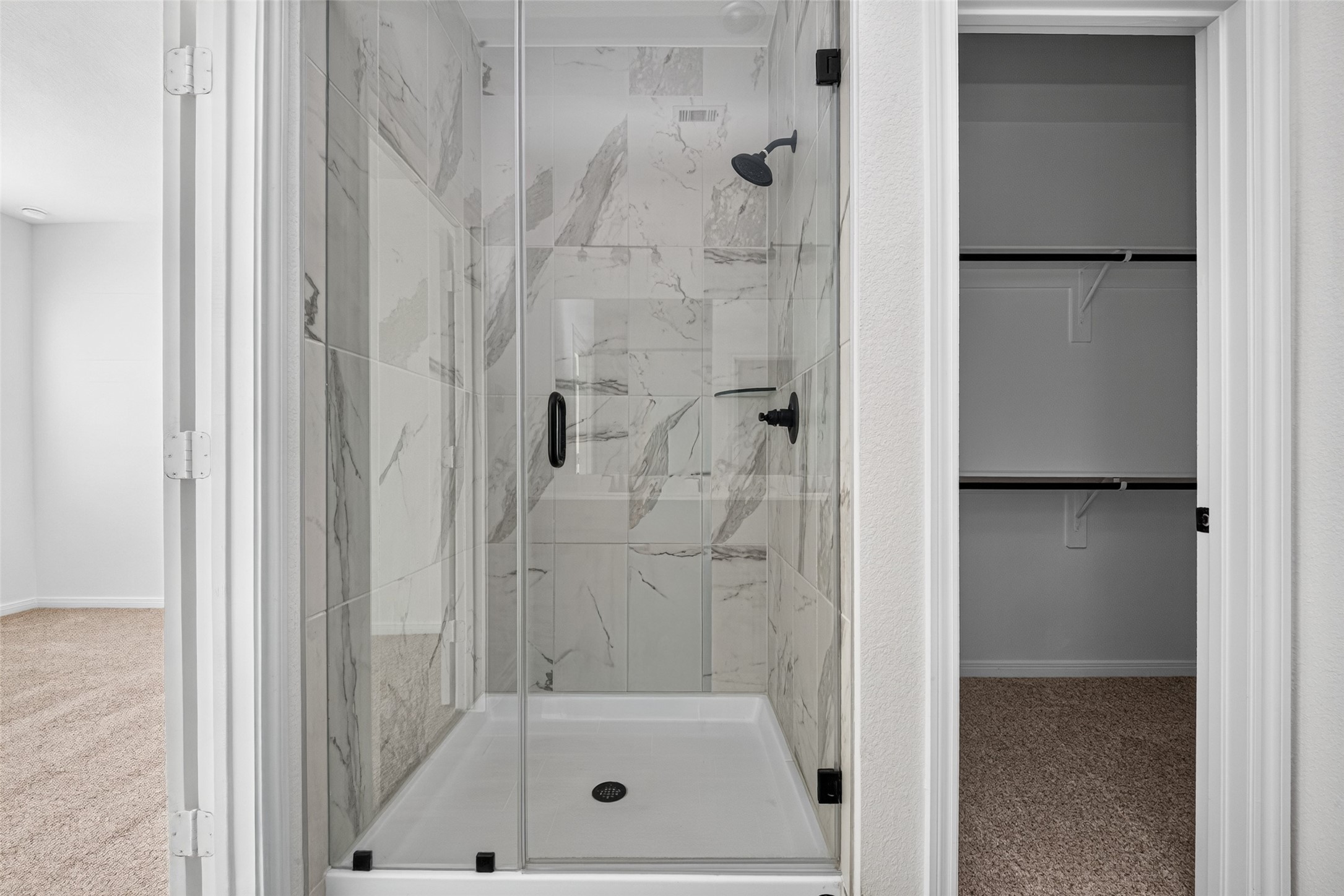 Primary shower and entrance to the walking closet