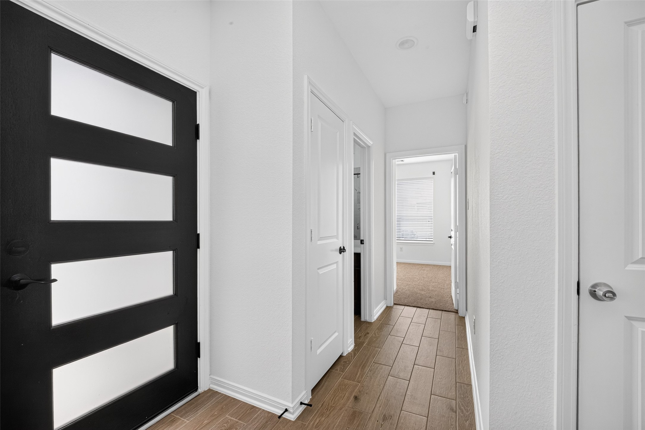 Hall to secondary bathroom and bedroom